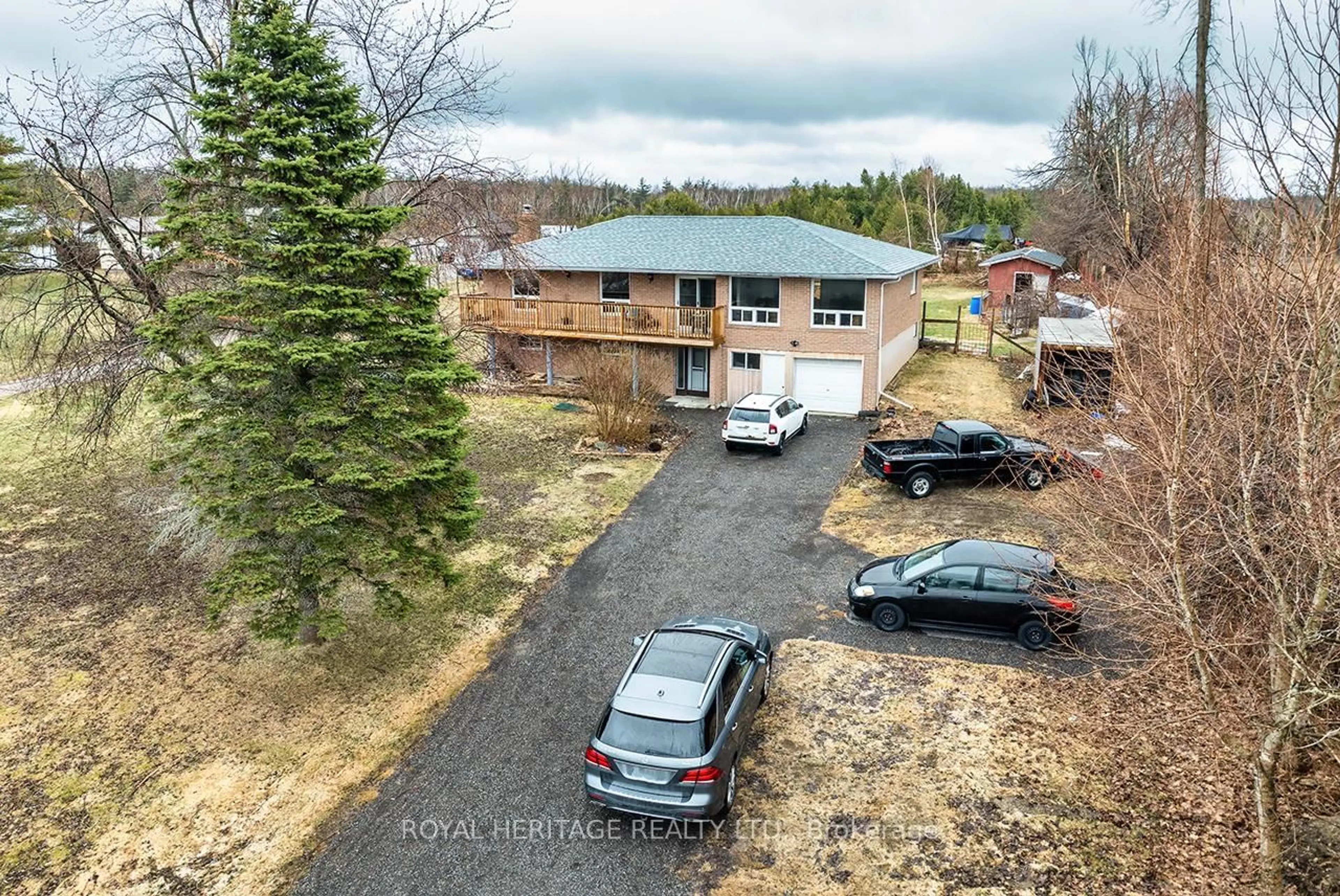 A pic from outside/outdoor area/front of a property/back of a property/a pic from drone, street for 940 Portage Rd, Kawartha Lakes Ontario K0M 2B0