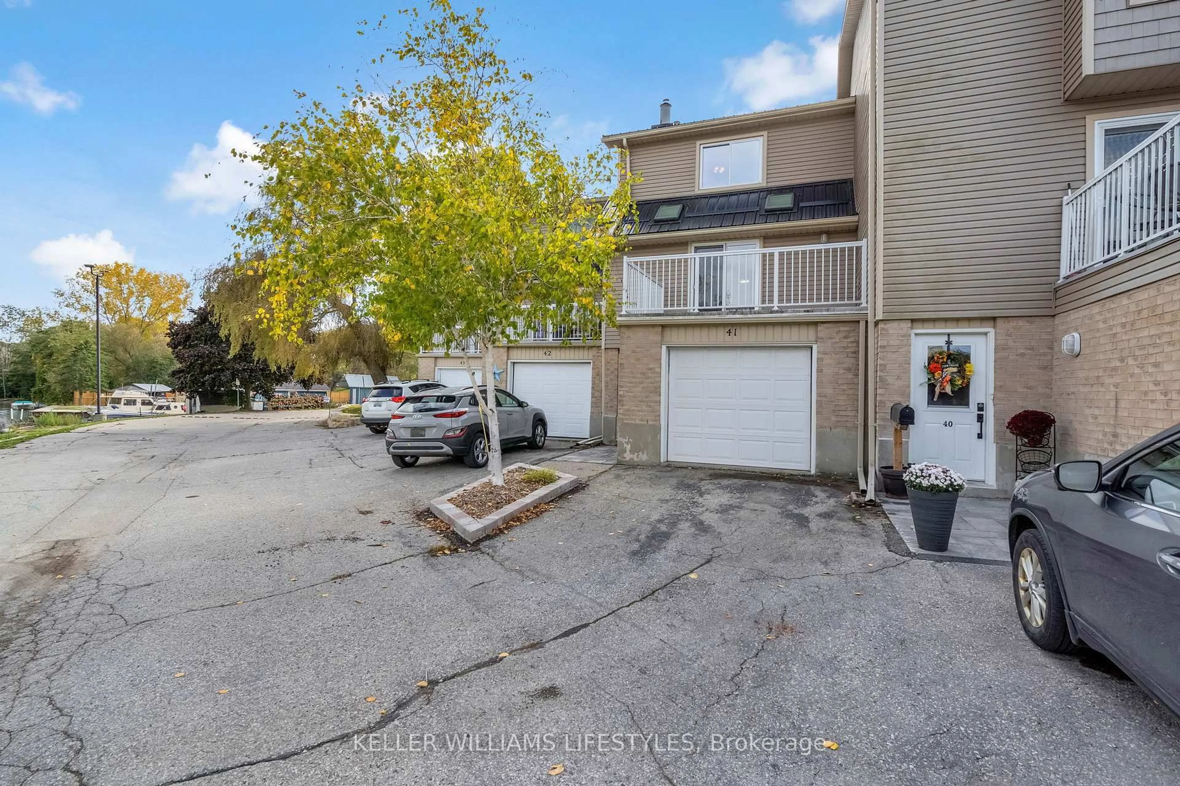 A pic from outside/outdoor area/front of a property/back of a property/a pic from drone, street for 301 Carlow Rd #41, Central Elgin Ontario N5L 1B8