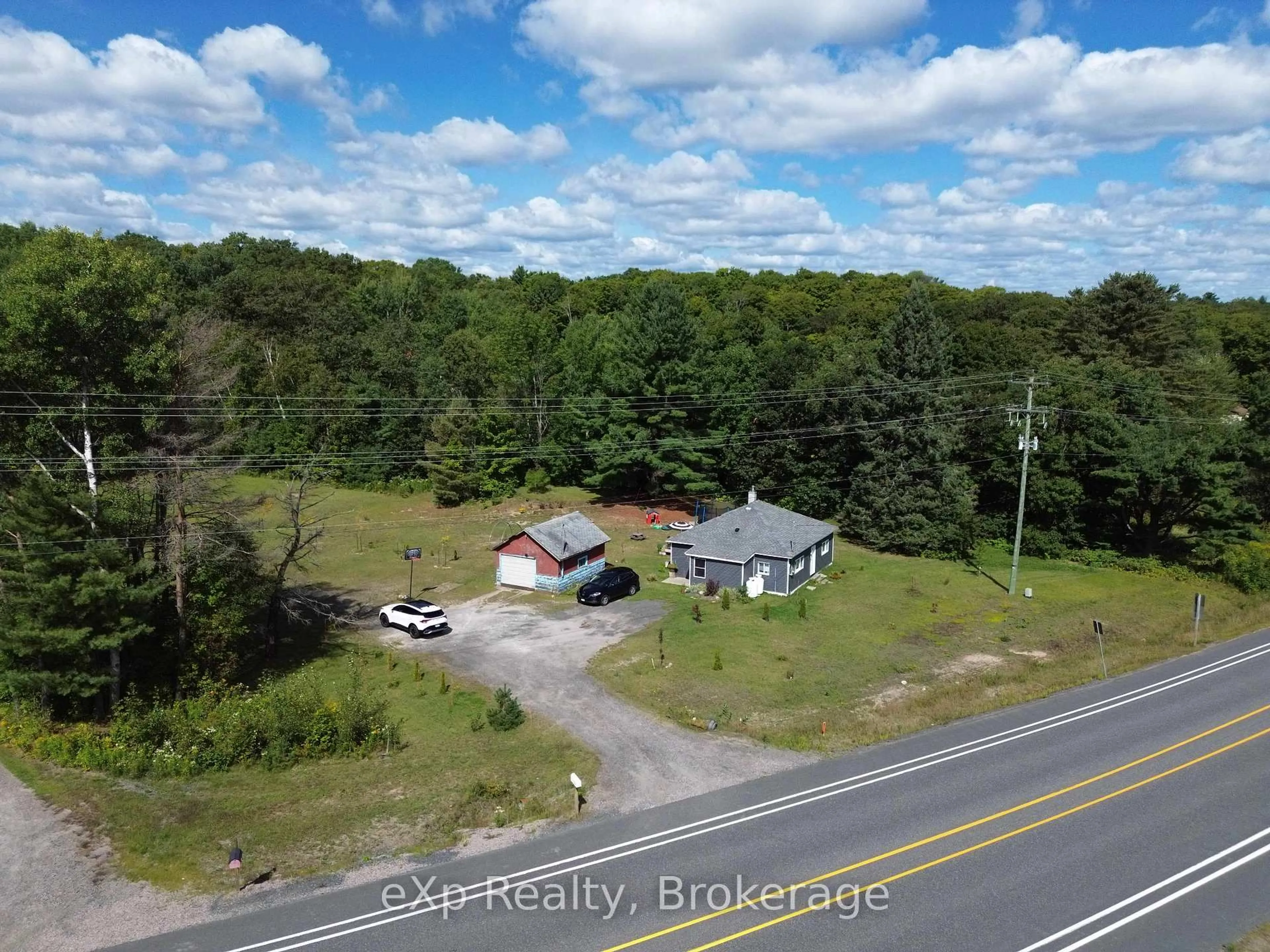 A pic from outside/outdoor area/front of a property/back of a property/a pic from drone, unknown for 62 Highway 124, McDougall Ontario P2A 2W9