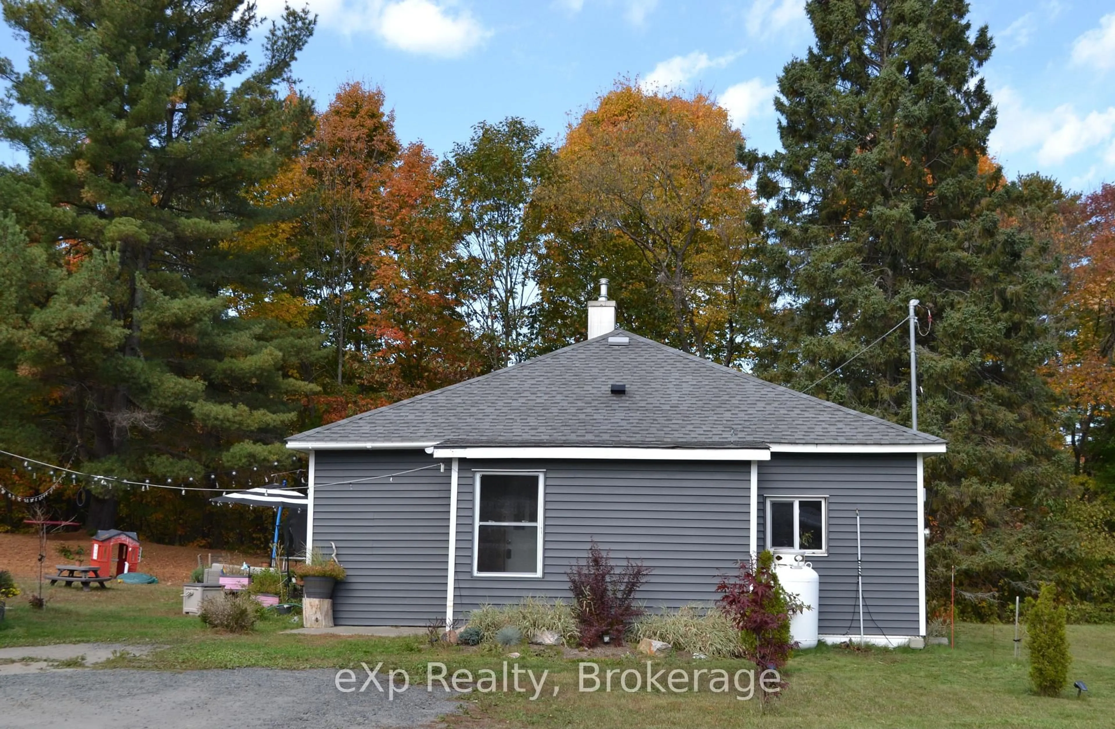 A pic from outside/outdoor area/front of a property/back of a property/a pic from drone, street for 62 Highway 124, McDougall Ontario P2A 2W9