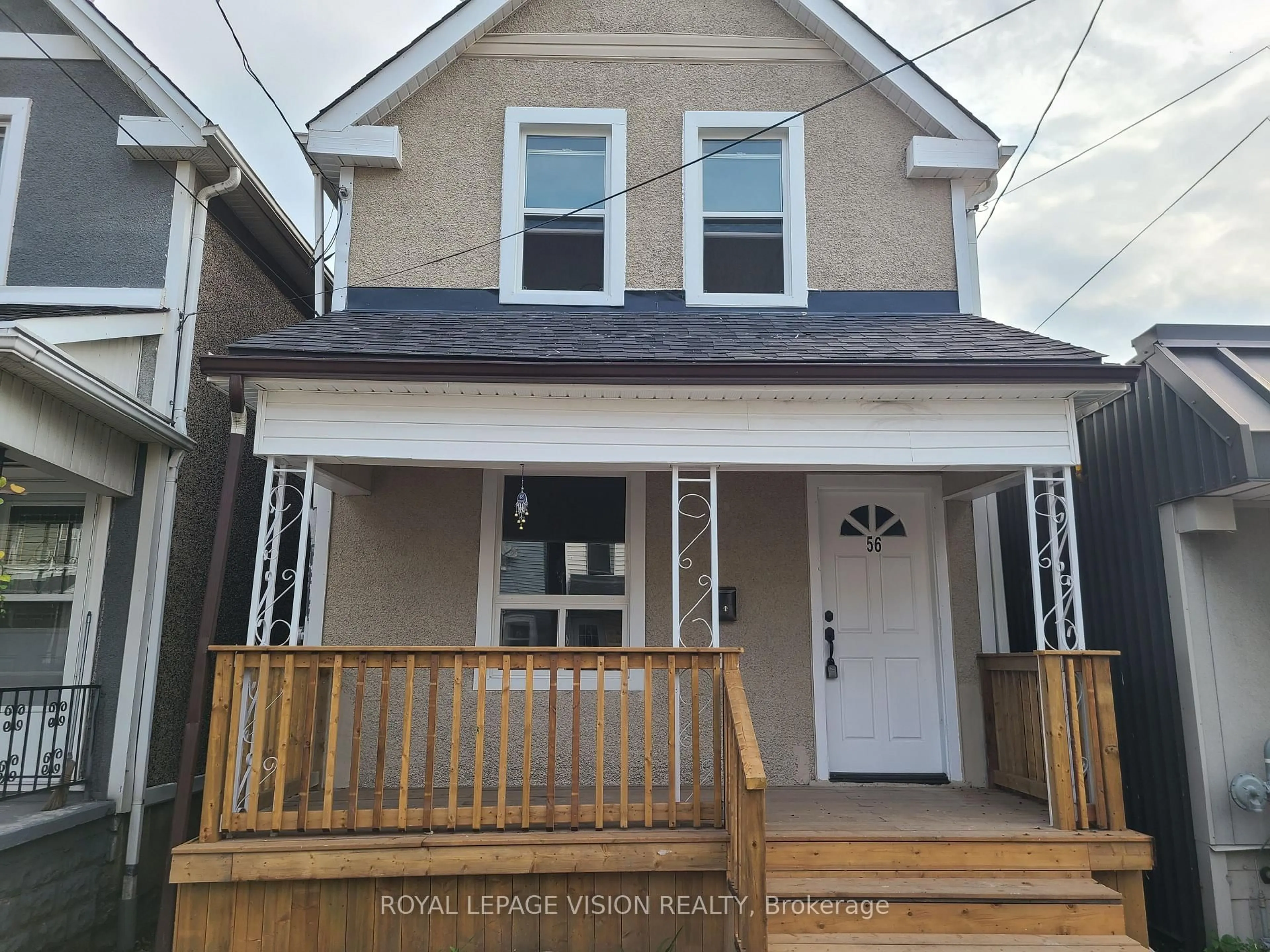 Home with vinyl exterior material, street for 56 Munroe St, Hamilton Ontario L8L 3V7