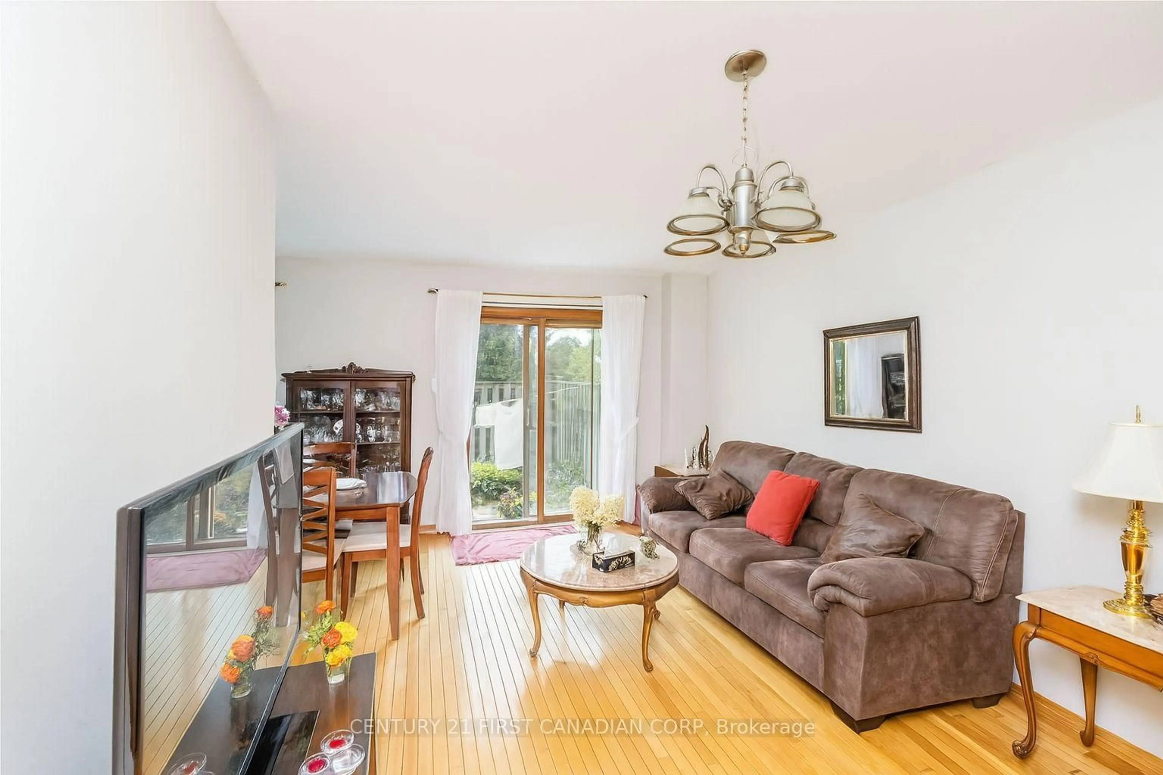 Living room with furniture, wood/laminate floor for 195 Deveron Cres #40, London South Ontario N5Z 4J7