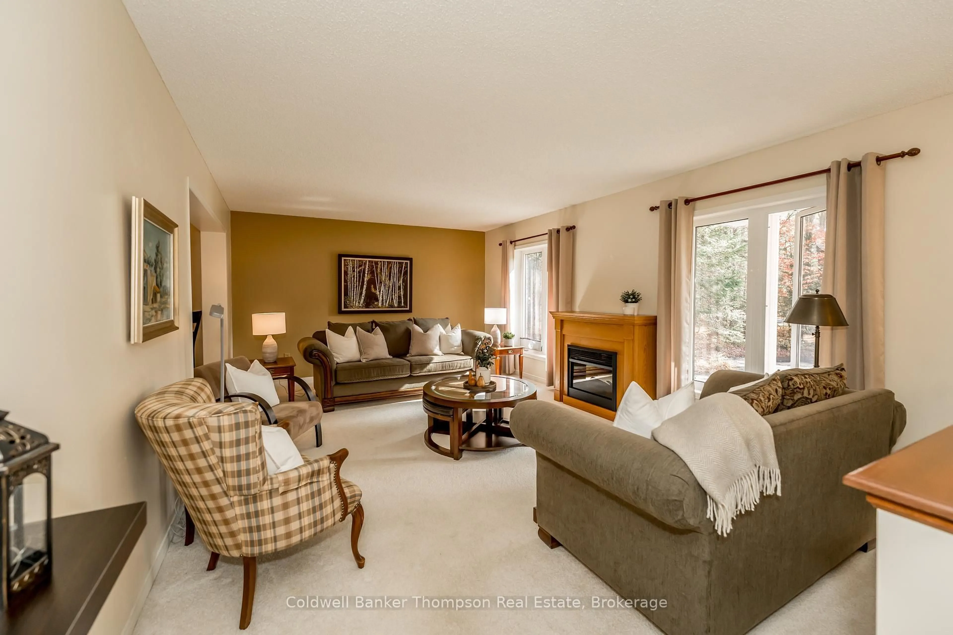 Living room with furniture, carpet floor for 252 Fowlers Rd, Huntsville Ontario P1H 0J8