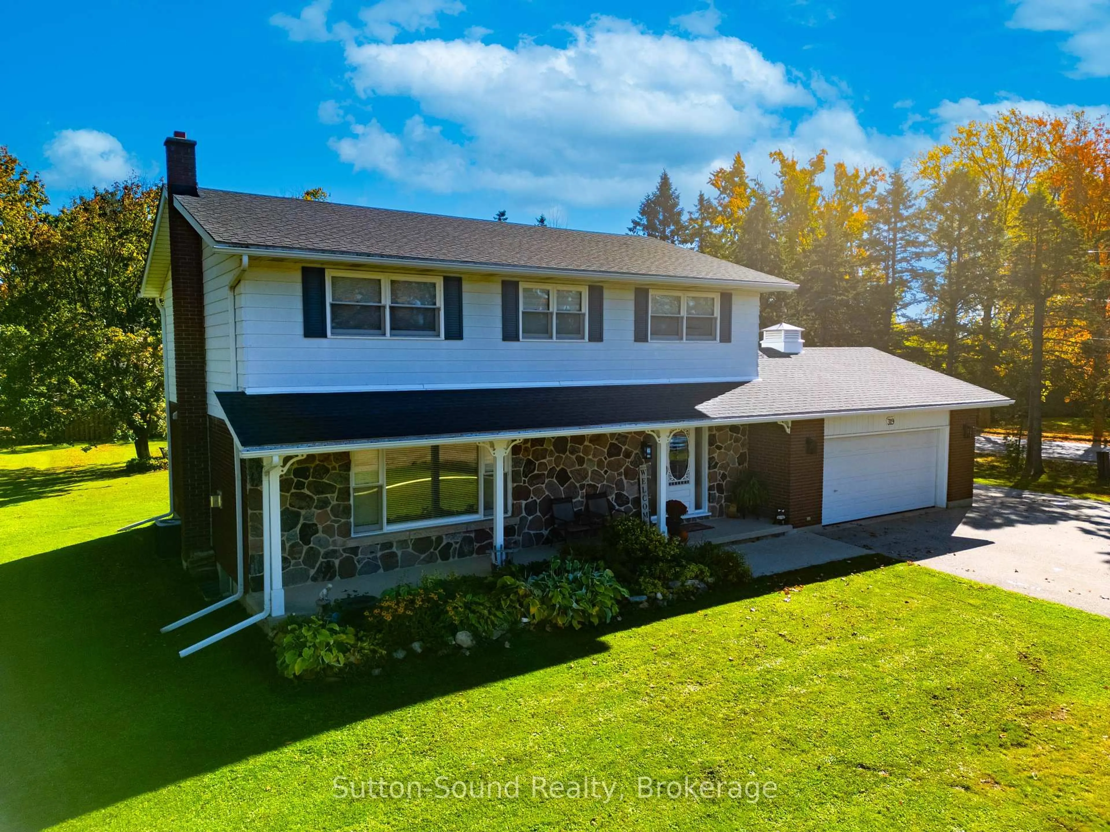 A pic from outside/outdoor area/front of a property/back of a property/a pic from drone, street for 319 Gould St, South Bruce Peninsula Ontario N0H 2T0