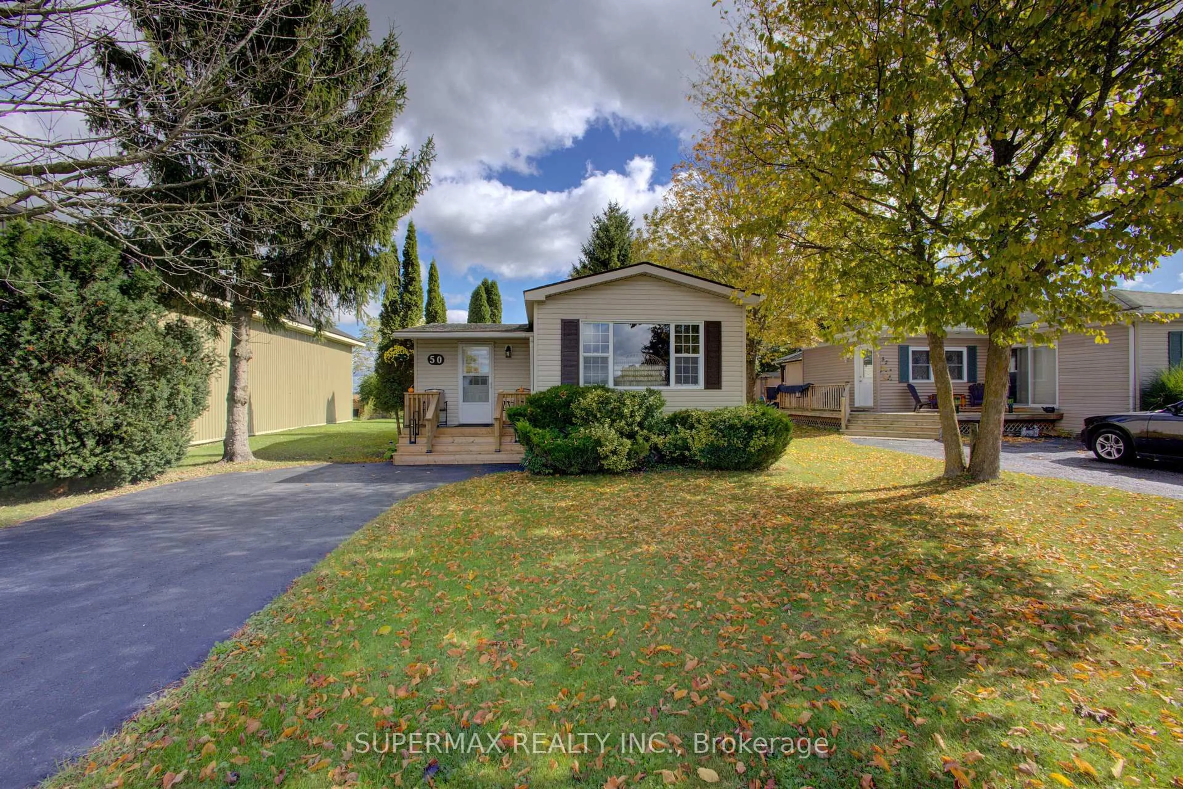 Home with vinyl exterior material, street for 302694 Douglas St #50, West Grey Ontario N0G 1R0