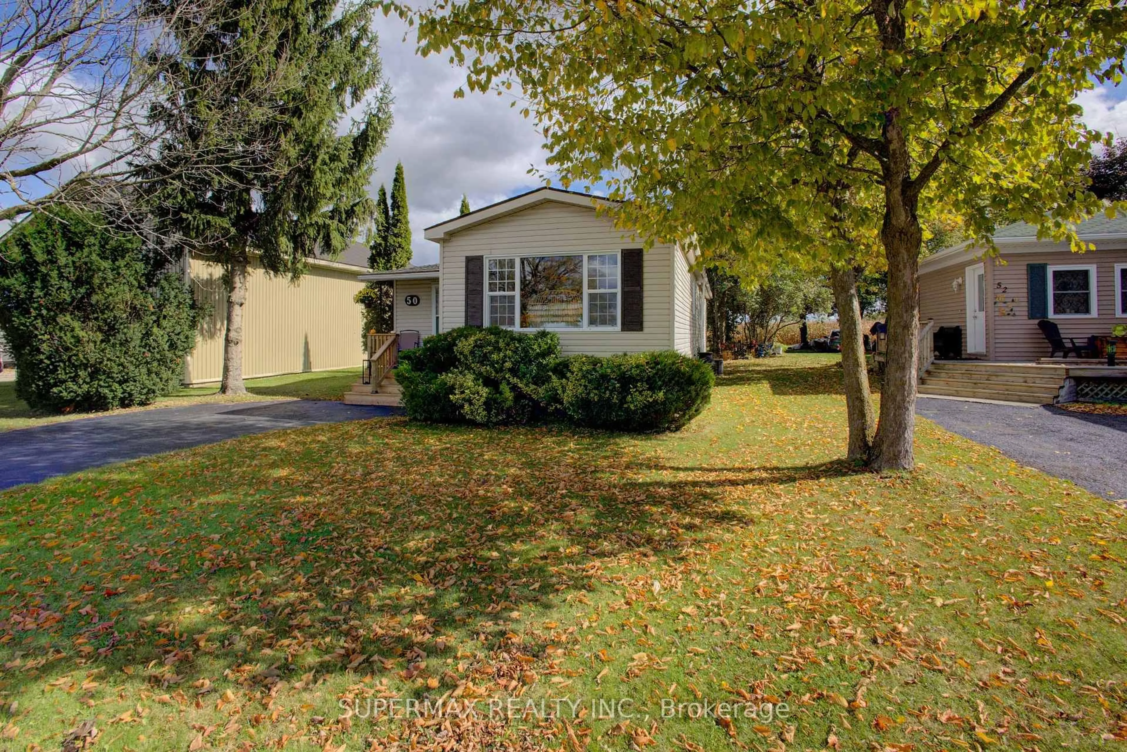 Home with vinyl exterior material, street for 302694 Douglas St #50, West Grey Ontario N0G 1R0
