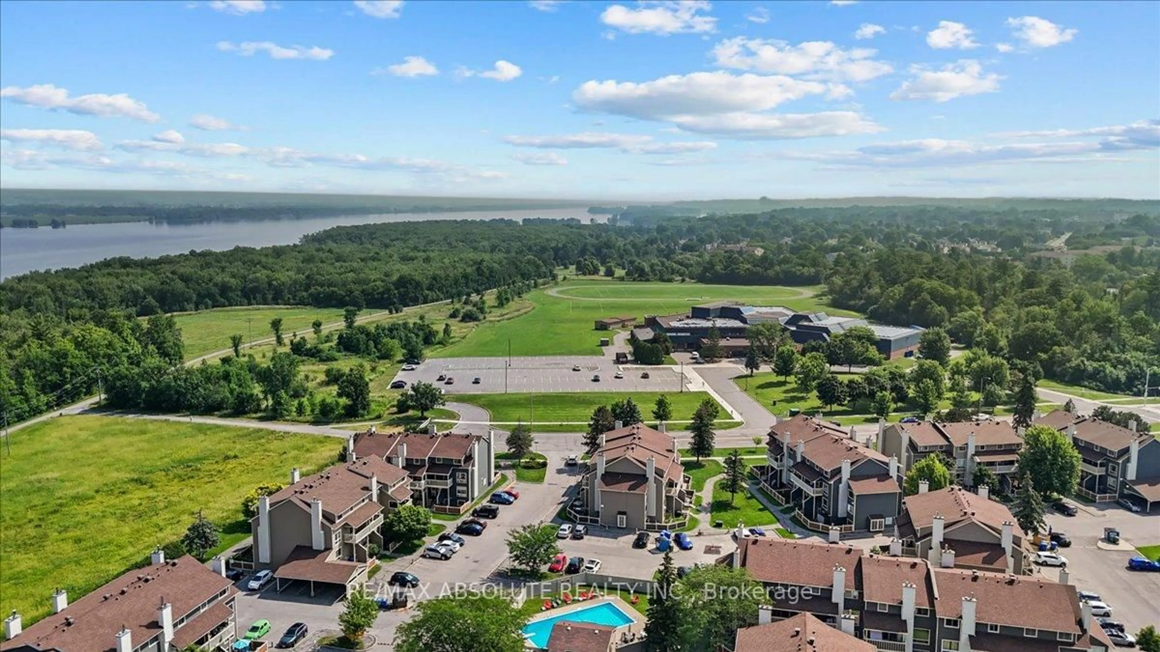 A pic from outside/outdoor area/front of a property/back of a property/a pic from drone, water/lake/river/ocean view for 750 St Andre Dr #73B, Orleans Ontario K1C 4R8