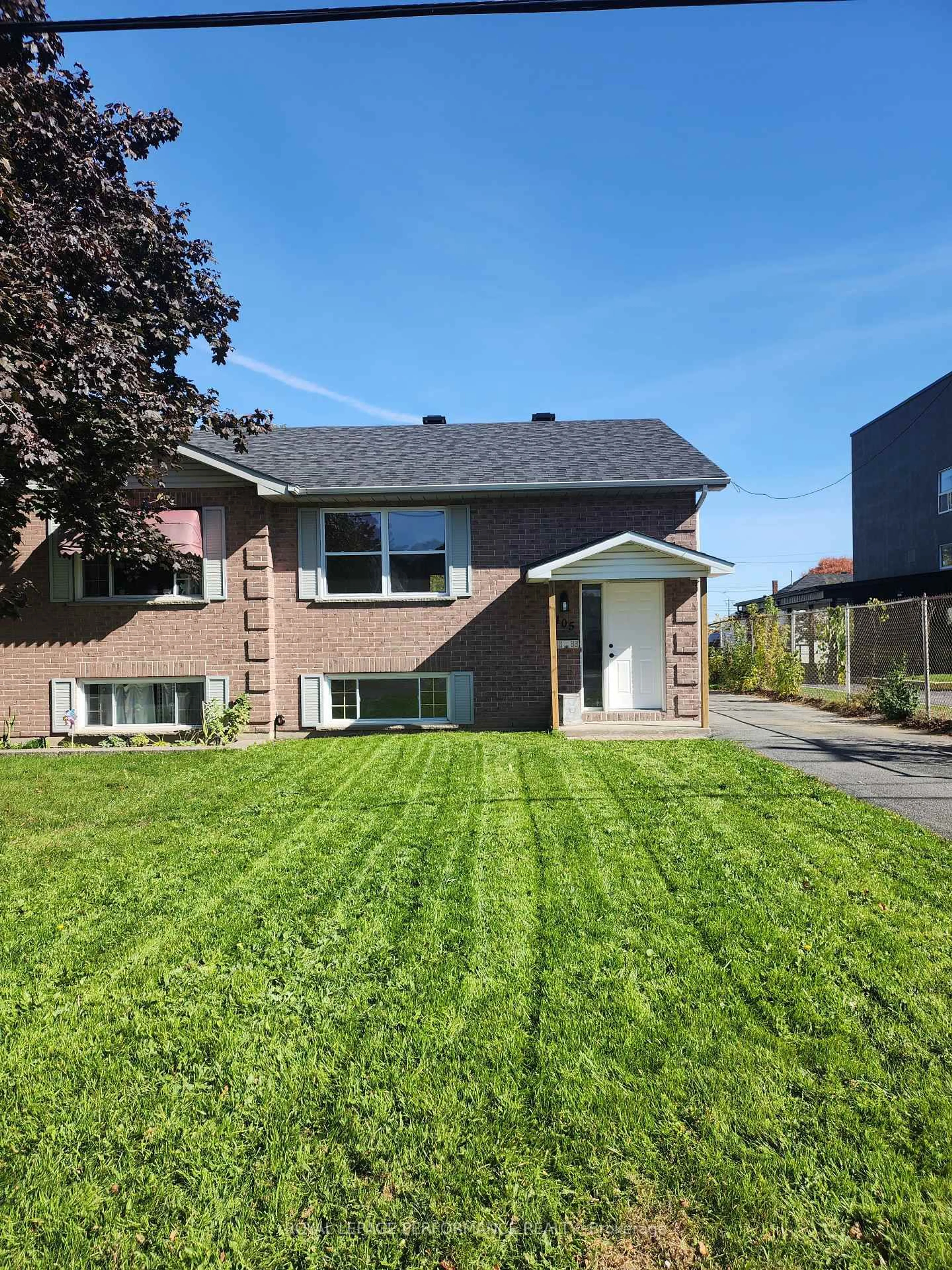 Home with brick exterior material, street for 405 Carleton St, Cornwall Ontario K6H 4X9
