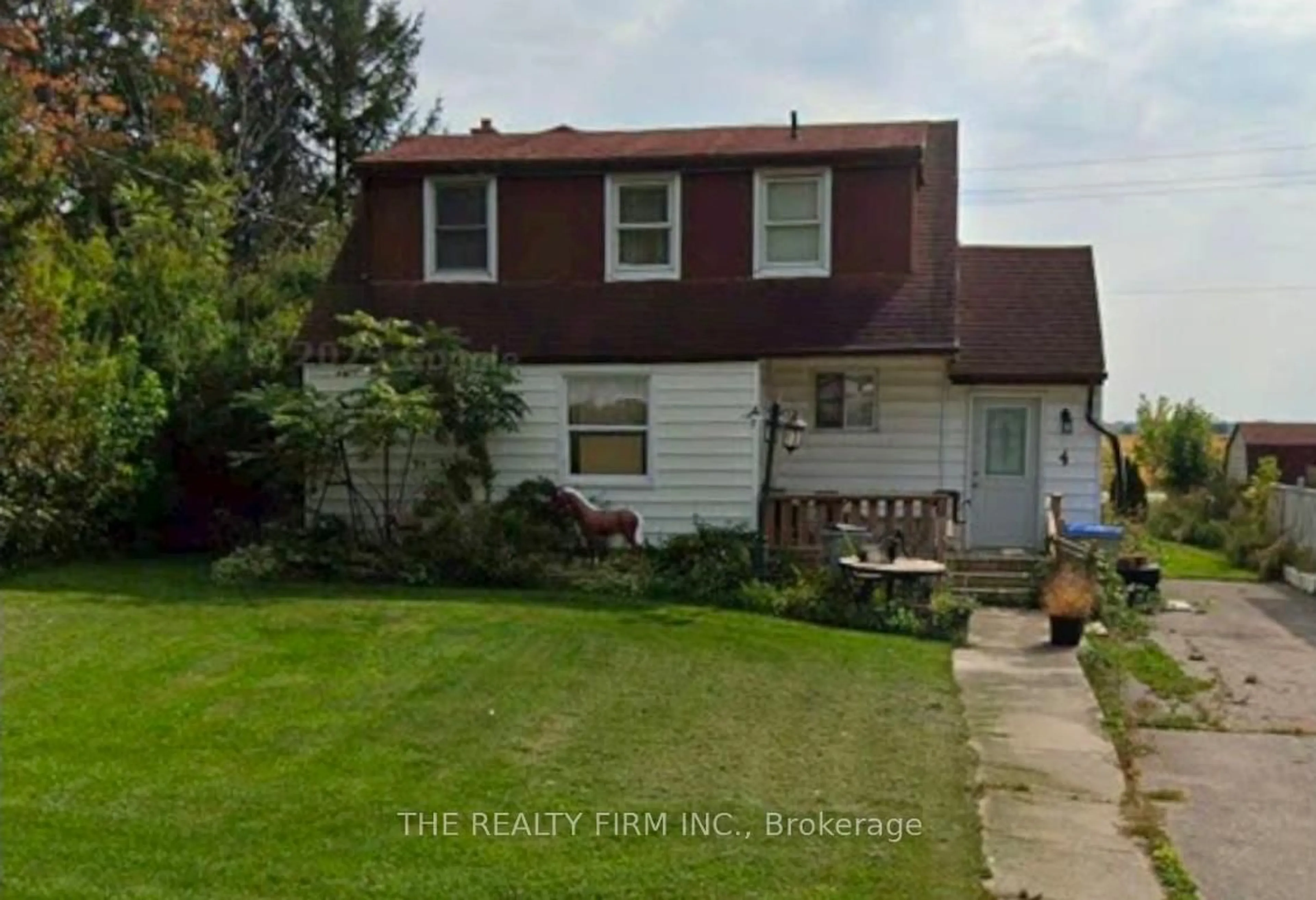 Home with vinyl exterior material, street for 4 Quebec Rd, Huron East Ontario N0M 1L0