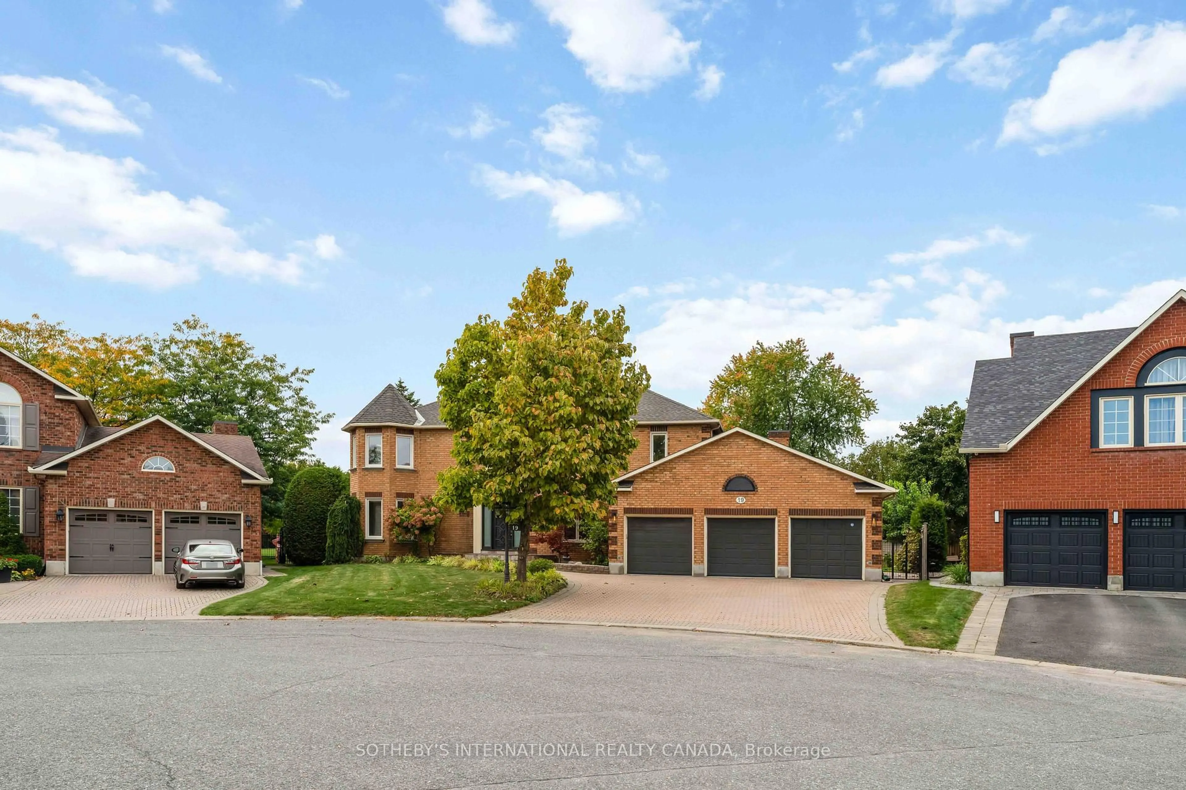 Home with brick exterior material, street for 19 Campfield Crt, Ottawa Ontario K2E 7X8