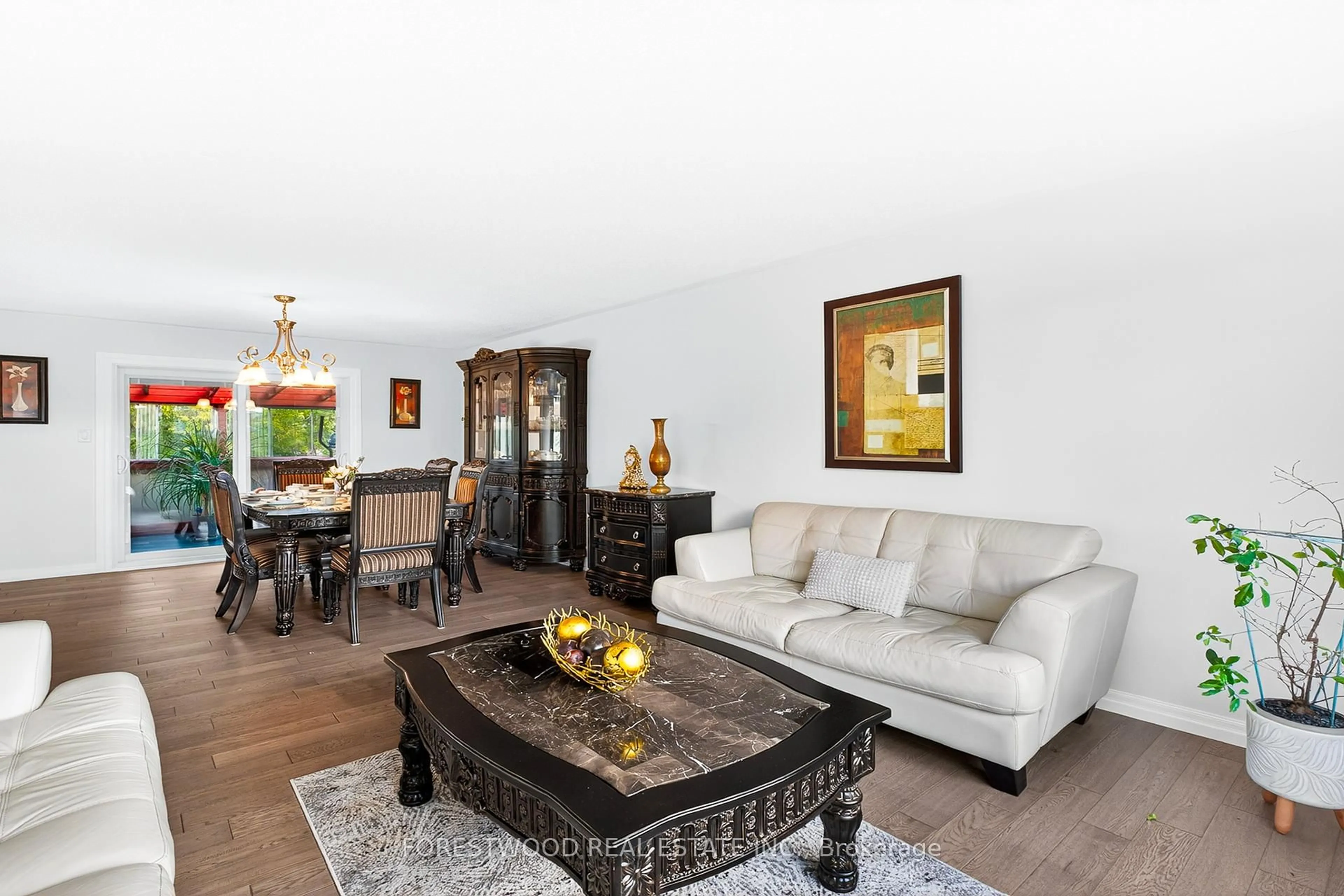 Living room with furniture, wood/laminate floor for 93 Deerhurst Rd, Hamilton Ontario L8E 3G2