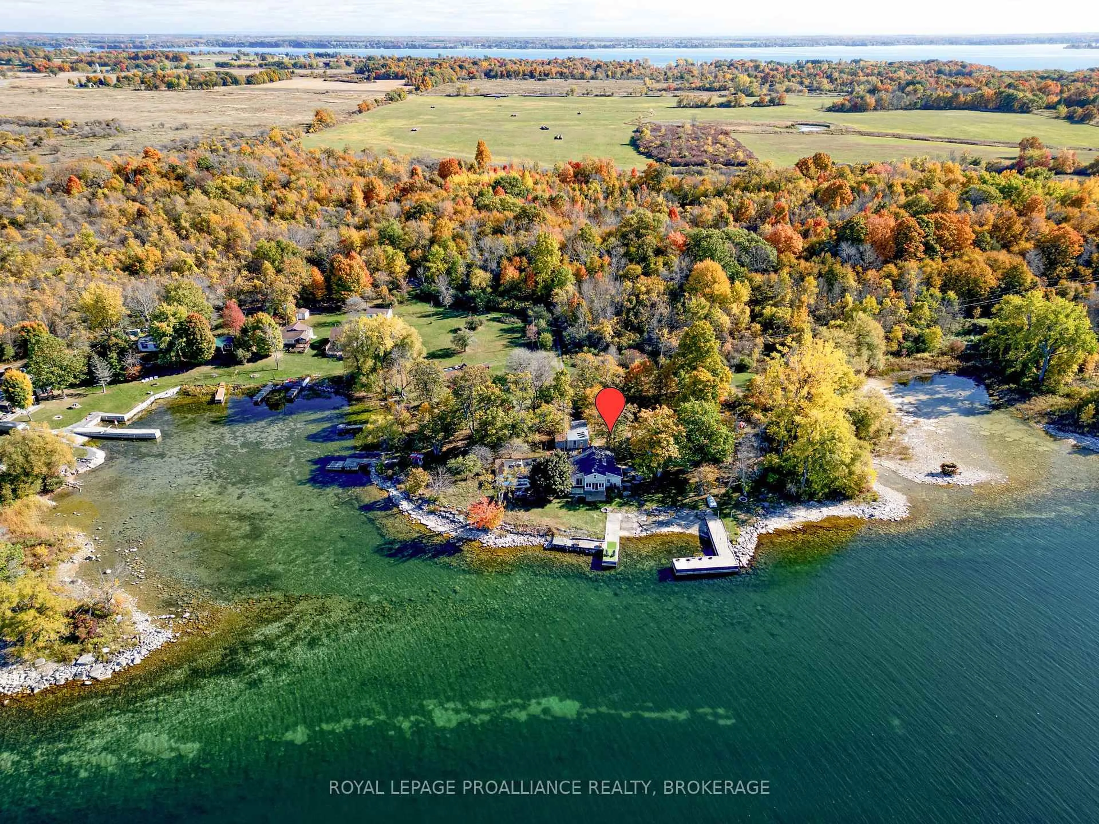 A pic from outside/outdoor area/front of a property/back of a property/a pic from drone, water/lake/river/ocean view for 14 Morgan's Point Lane #B, Wolfe Island Ontario K0H 2Y0