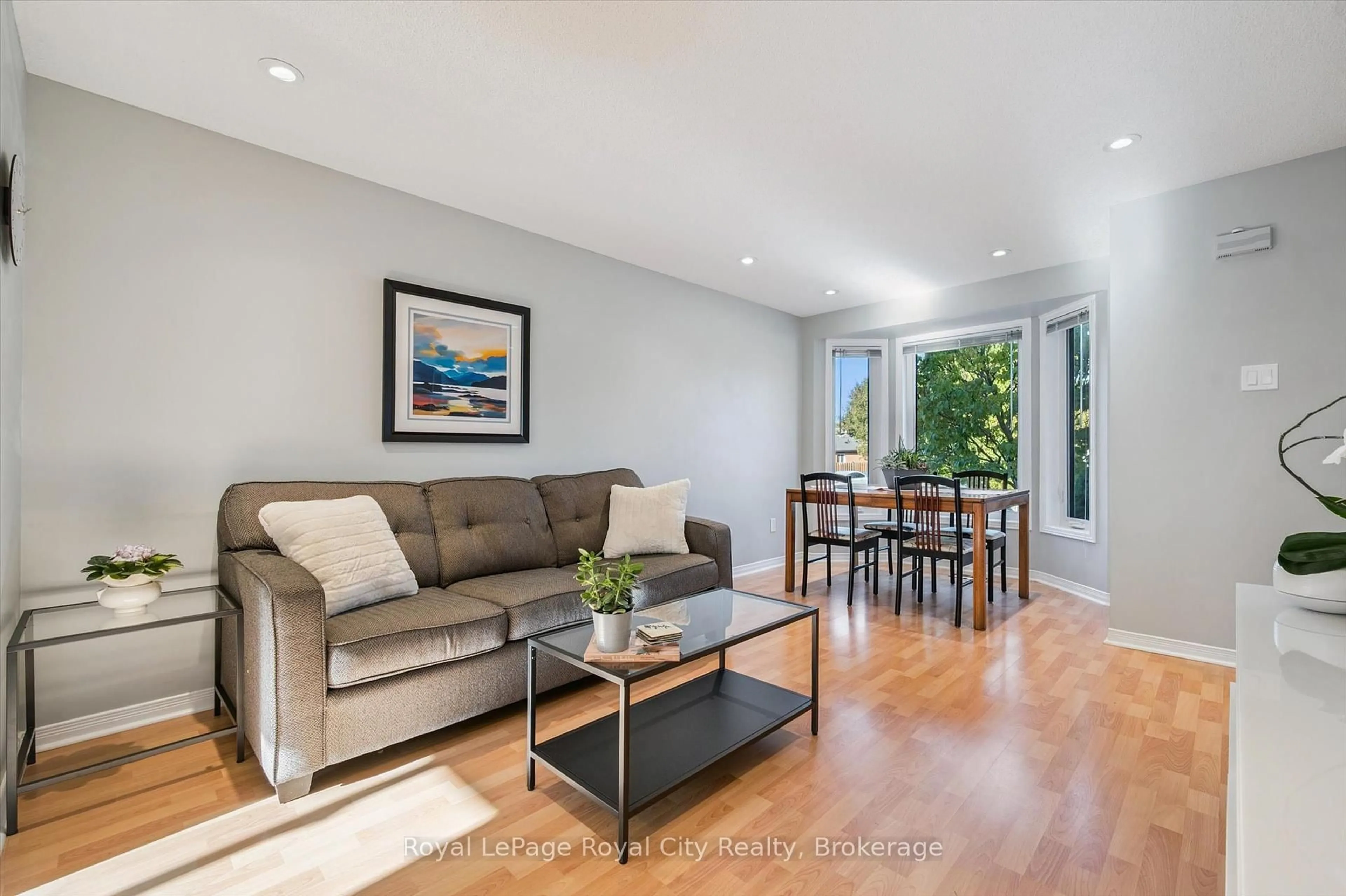 Living room with furniture, wood/laminate floor for 74 Troy Cres, Guelph Ontario N1E 6W8