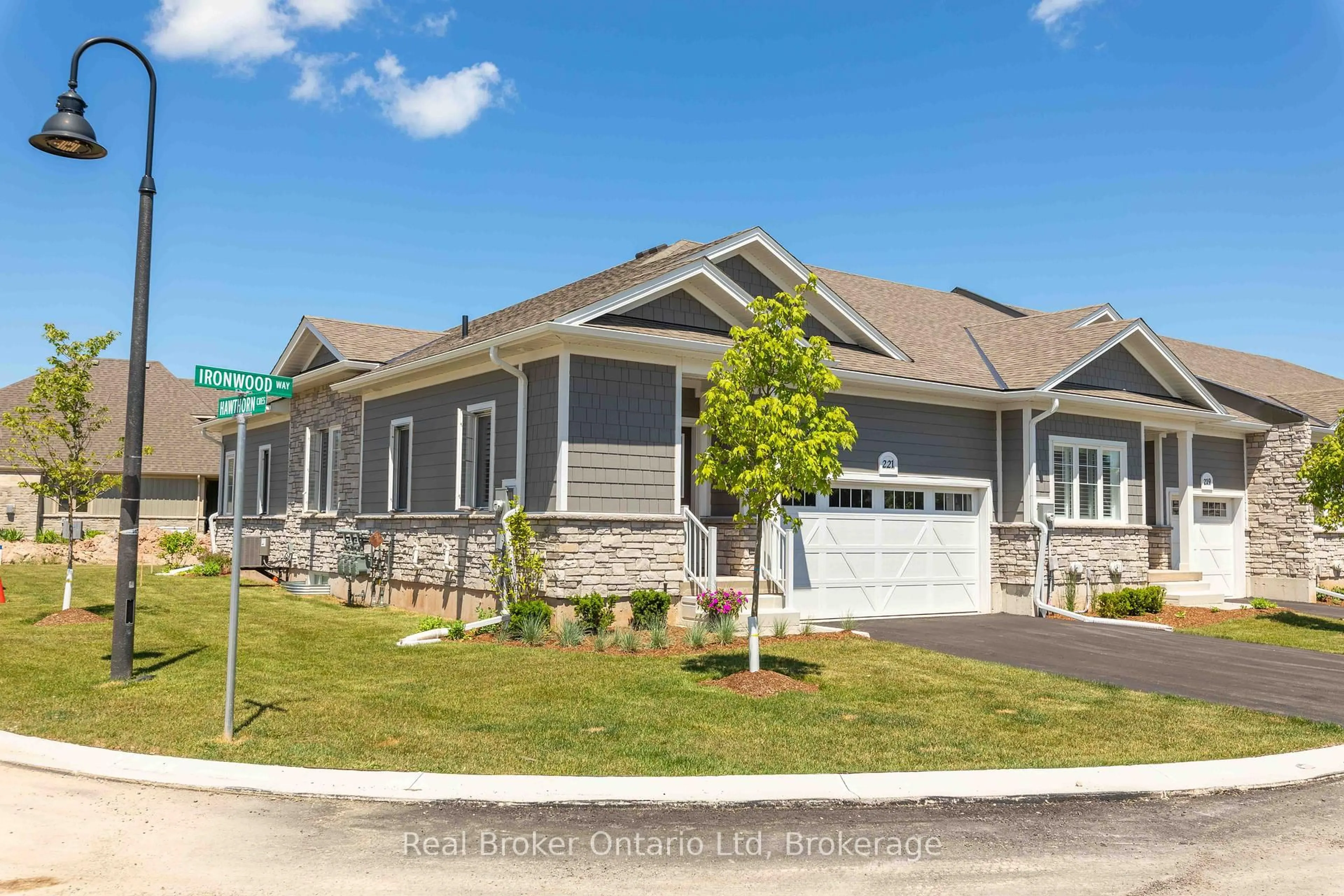 Home with vinyl exterior material, street for 221 Ironwood Way #18, Georgian Bluffs Ontario N0H 1S0