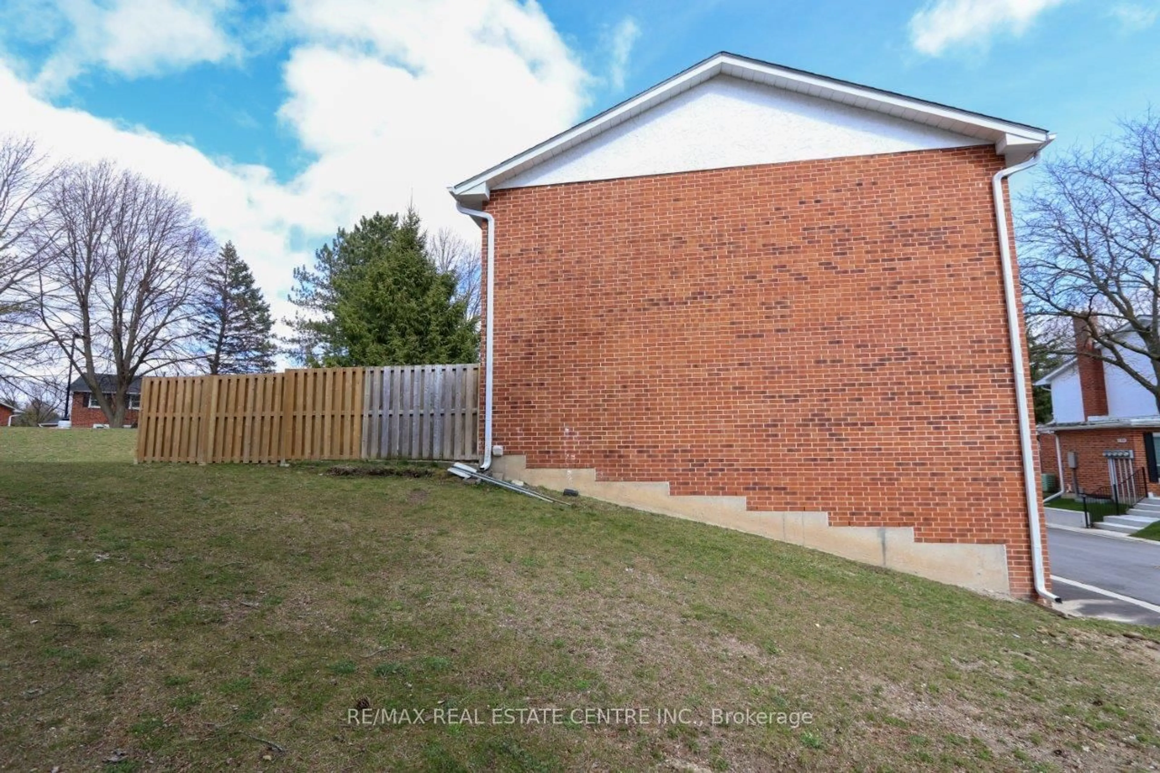 Home with brick exterior material, street for 411 Keats Way #1, Waterloo Ontario N2L 5S7