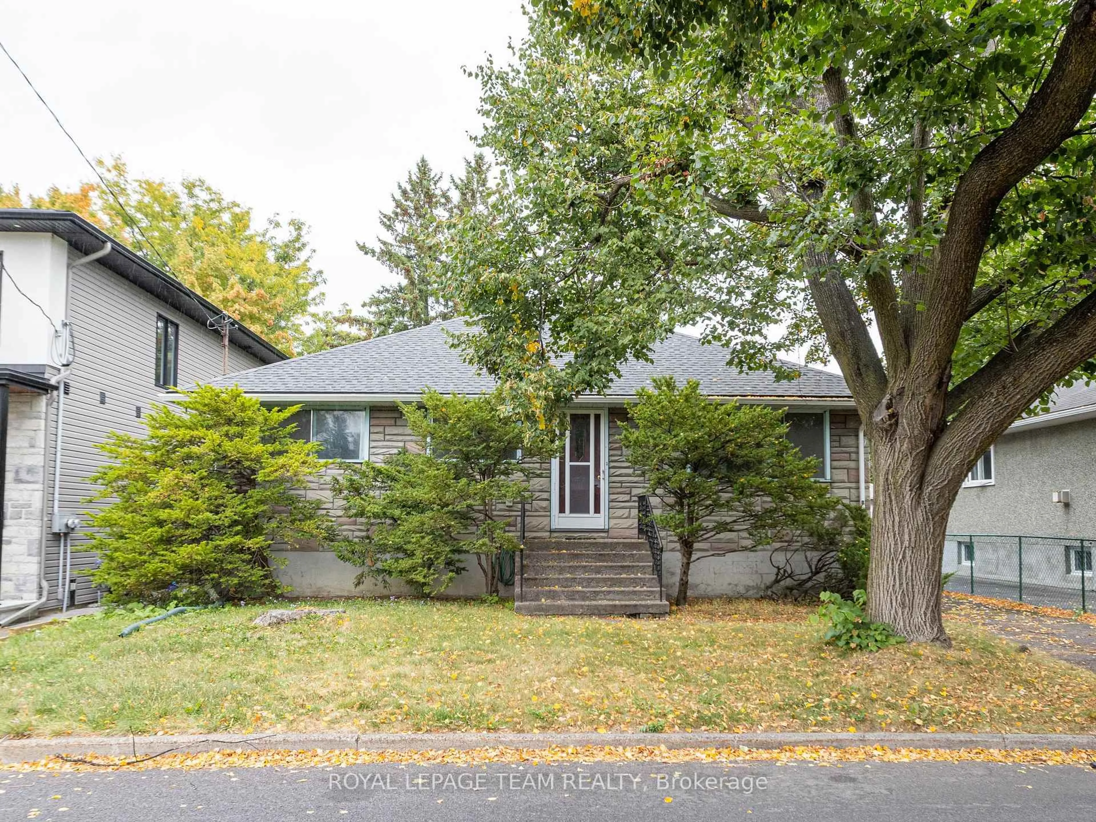 Home with vinyl exterior material, street for 1231 Ridgemont Ave, Ottawa Ontario K1V 6E6