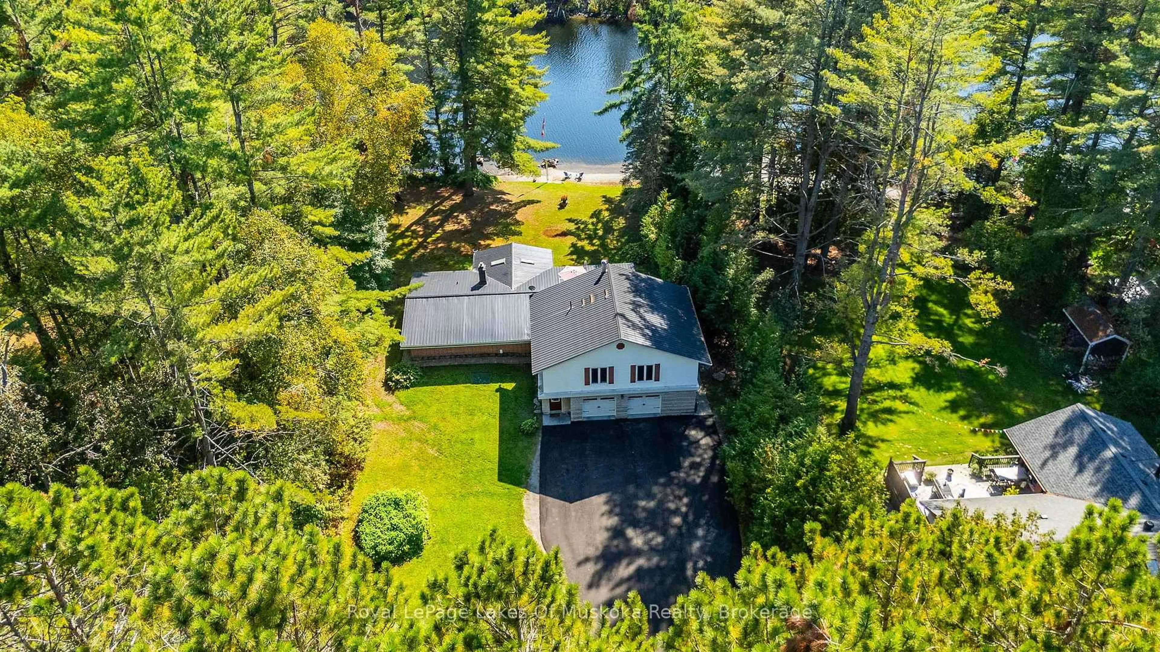 A pic from outside/outdoor area/front of a property/back of a property/a pic from drone, water/lake/river/ocean view for 50 Brofoco Dr, Bracebridge Ontario P1L 1C9