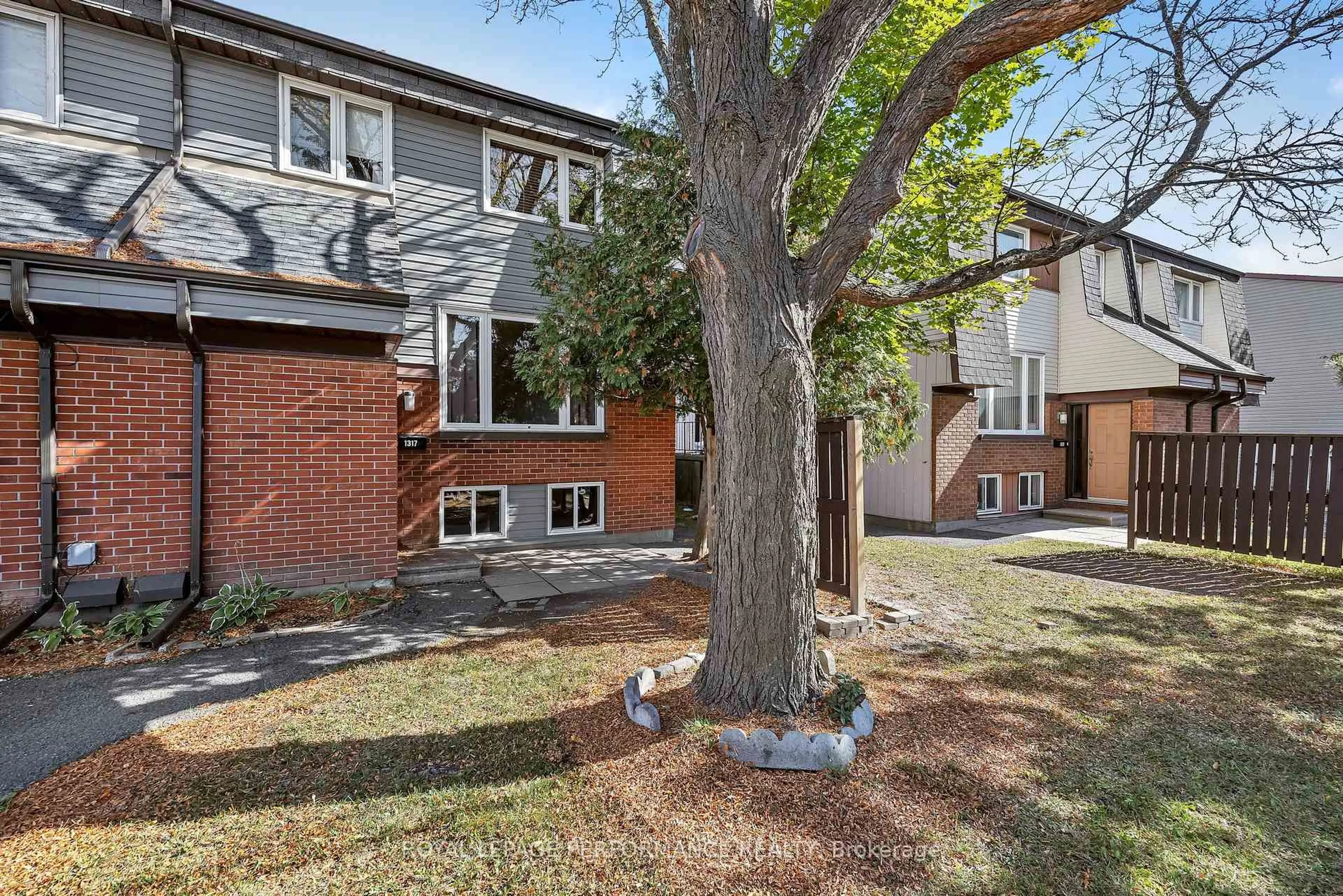 Home with brick exterior material, street for 1317 Marigold Cres #84, Ottawa Ontario K1B 5E7
