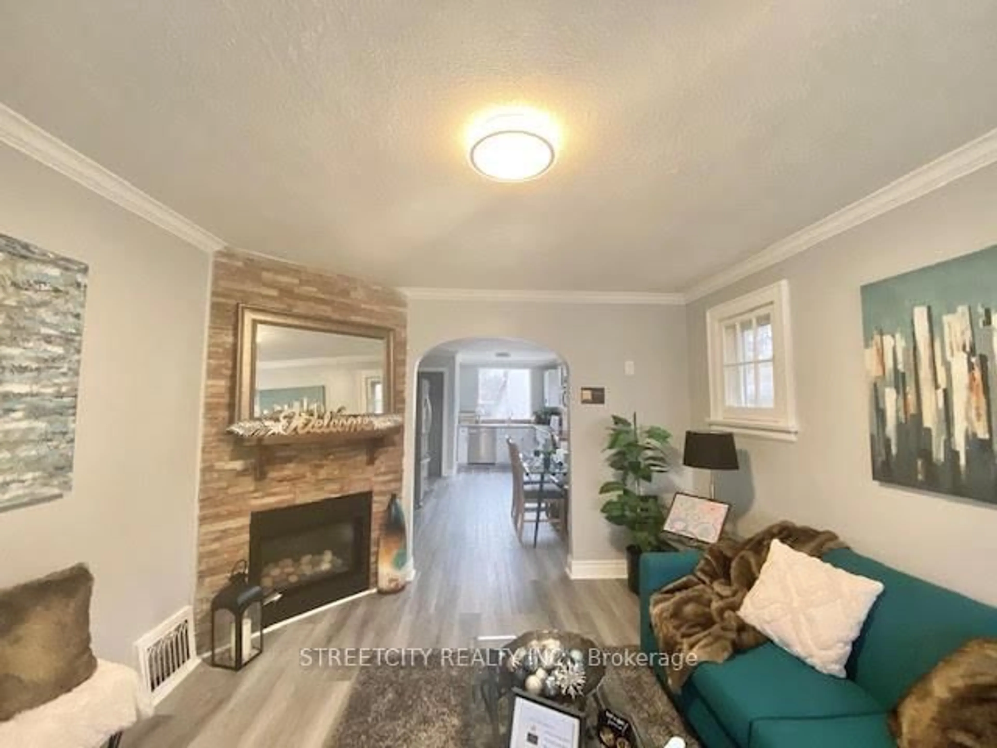 Living room with furniture, wood/laminate floor for 21 Eastman Ave, London East Ontario N5W 2M3
