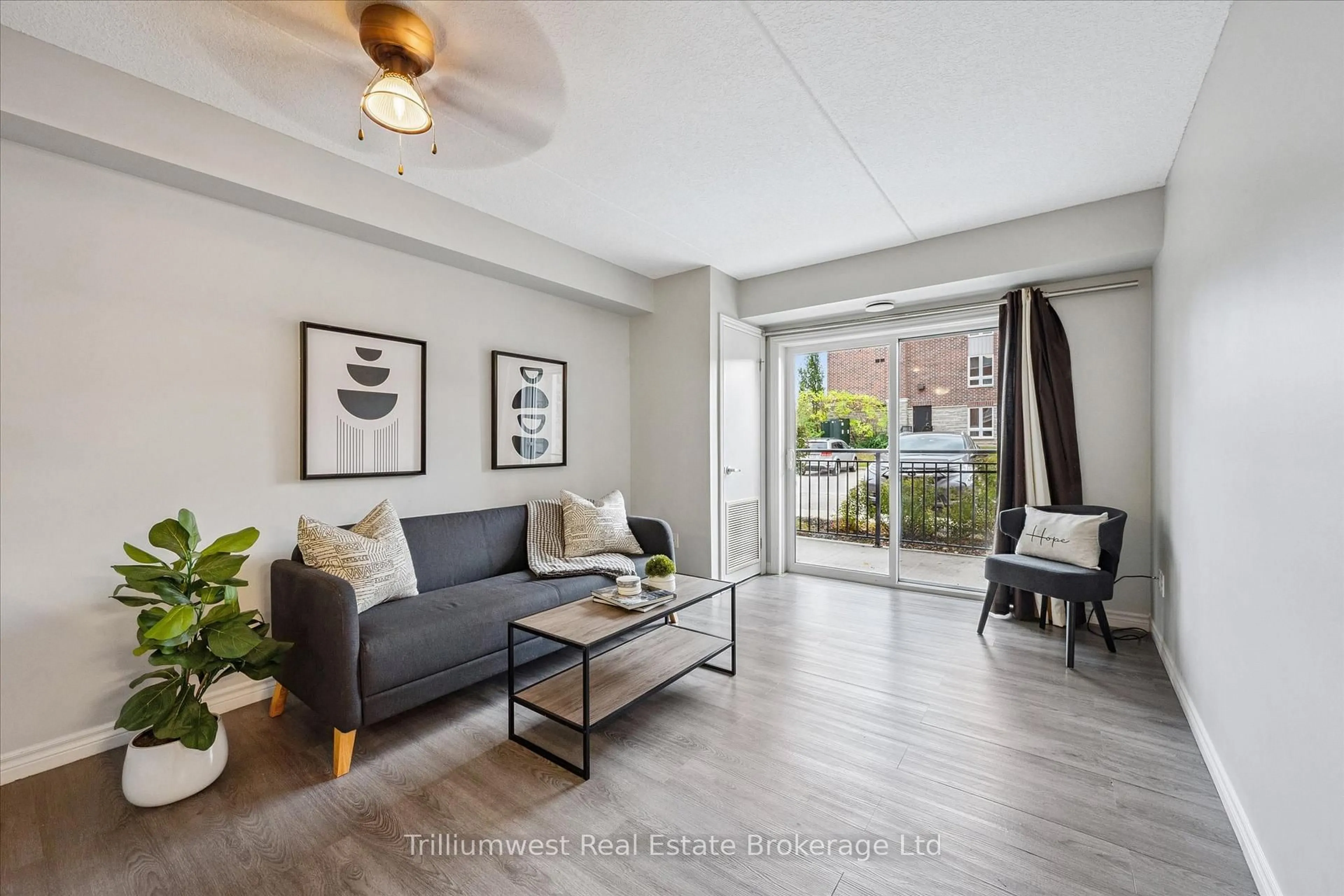 Living room with furniture, unknown for 39 Goodwin Dr #109, Guelph Ontario N1L 0E5