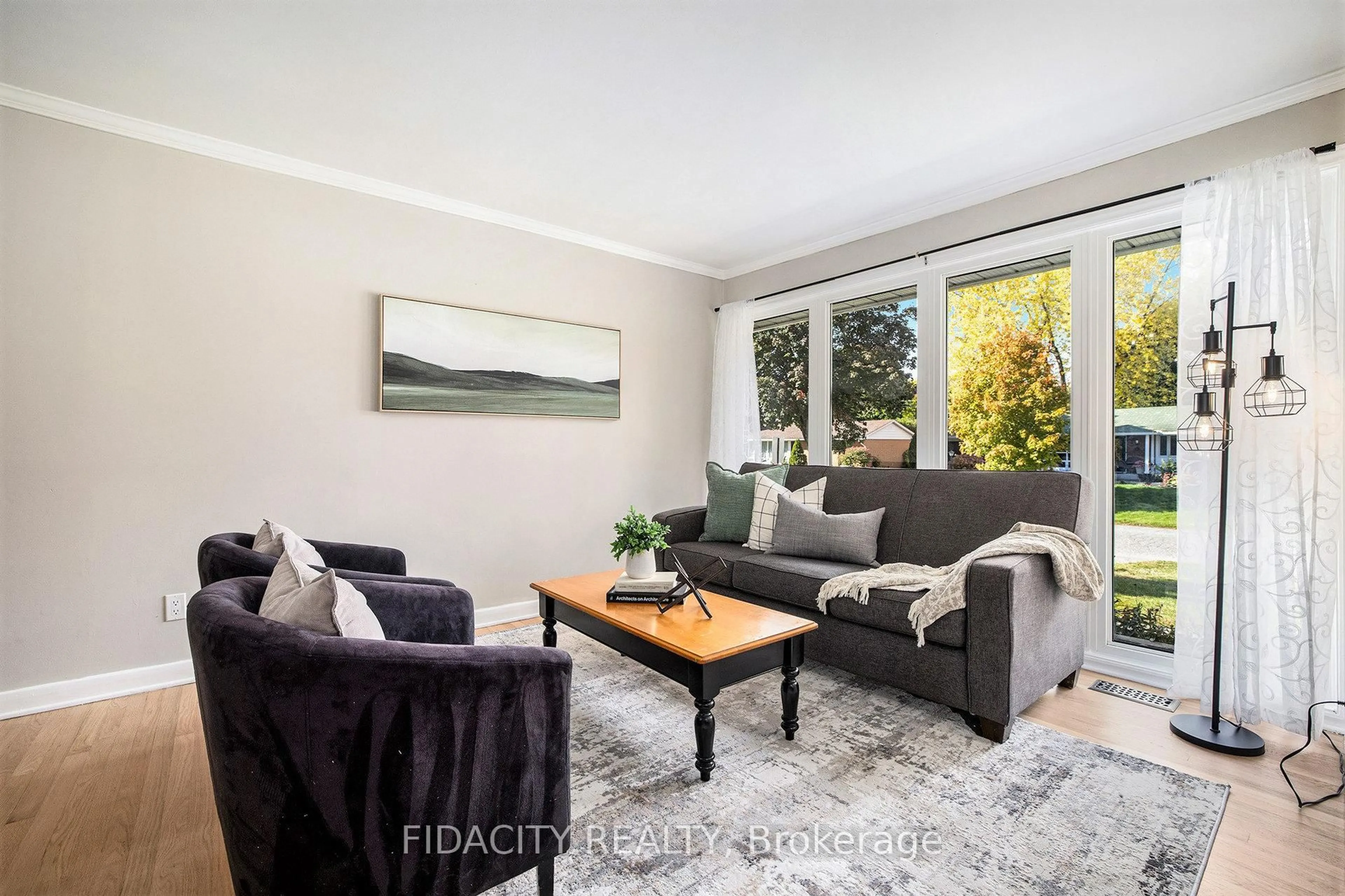 Living room with furniture, wood/laminate floor for 42 Stinson Ave, Ottawa Ontario K2H 6N4