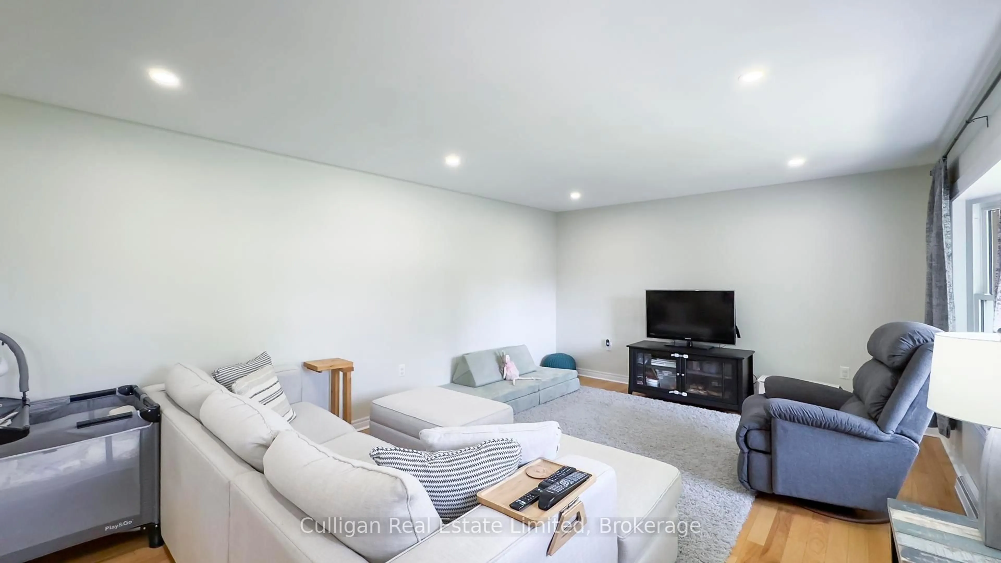 Living room with furniture, wood/laminate floor for 238 St. Andrew St, West Perth Ontario N0K 1N0