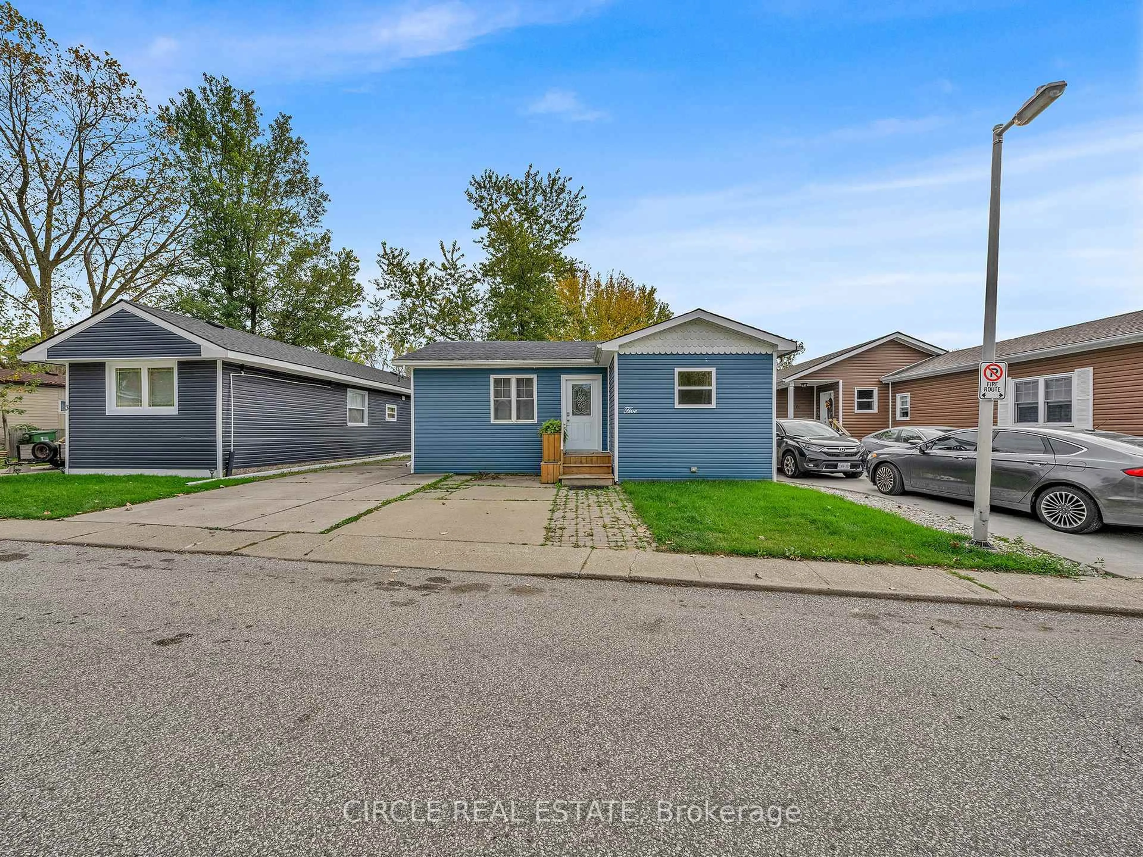 Home with vinyl exterior material, street for 5 Cherry St, Essex Ontario N0R 1J0