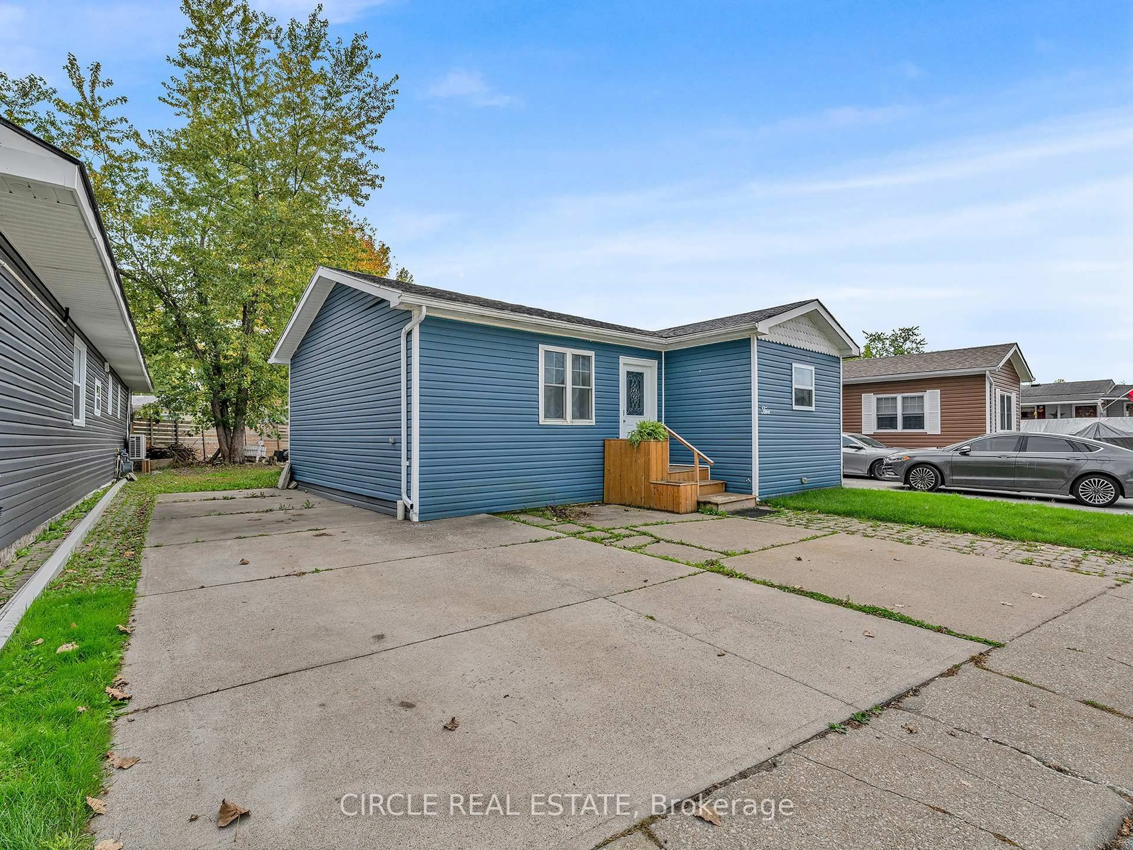 Home with vinyl exterior material, street for 5 Cherry St, Essex Ontario N0R 1J0