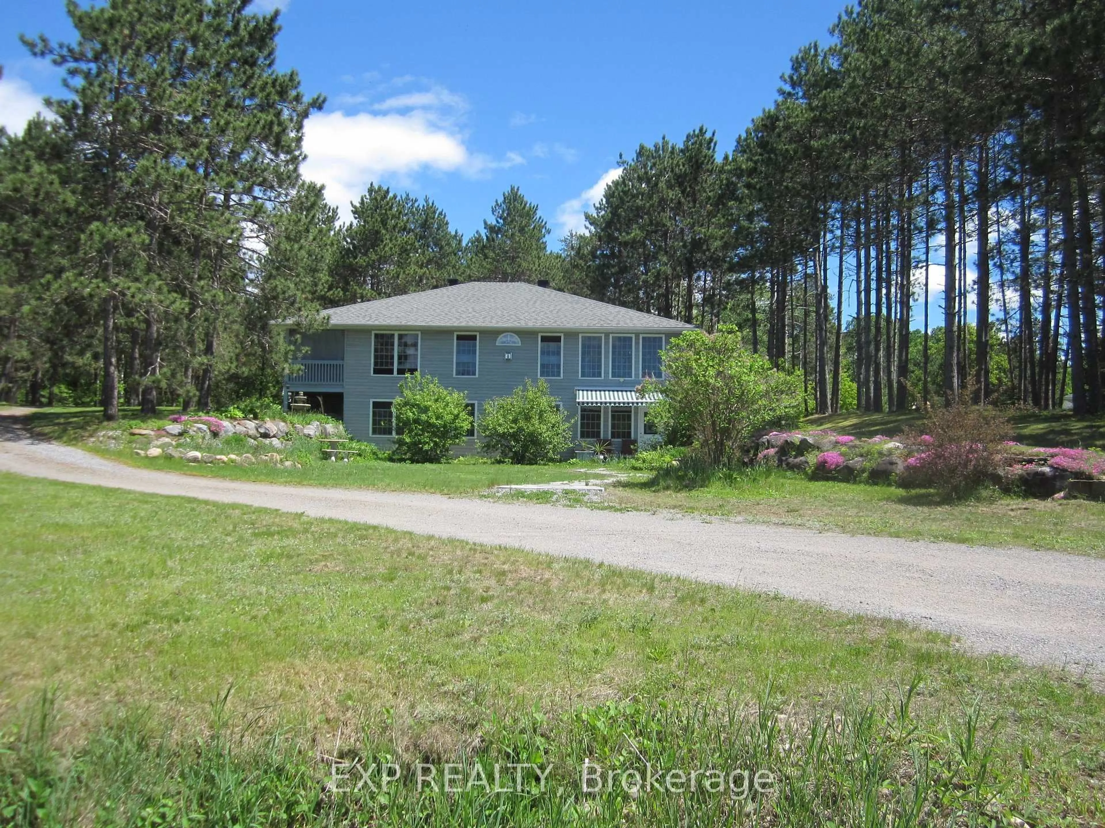A pic from outside/outdoor area/front of a property/back of a property/a pic from drone, forest/trees view for 10 Cybulski Rd, Barry's Bay Ontario K0J 1B0