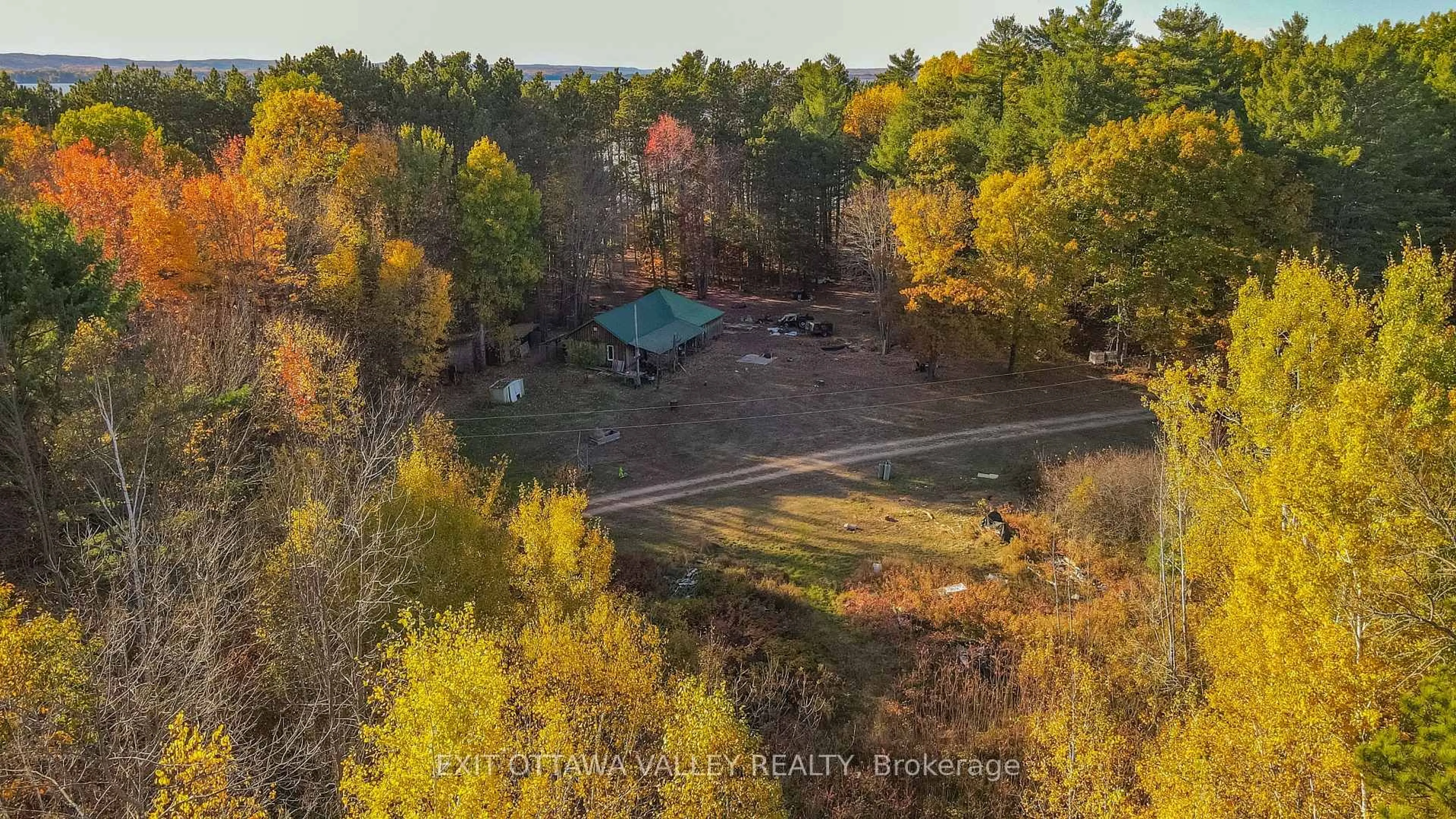 A pic from outside/outdoor area/front of a property/back of a property/a pic from drone, forest/trees view for 6 Grannys Lane, Killaloe Ontario K0J 2A0