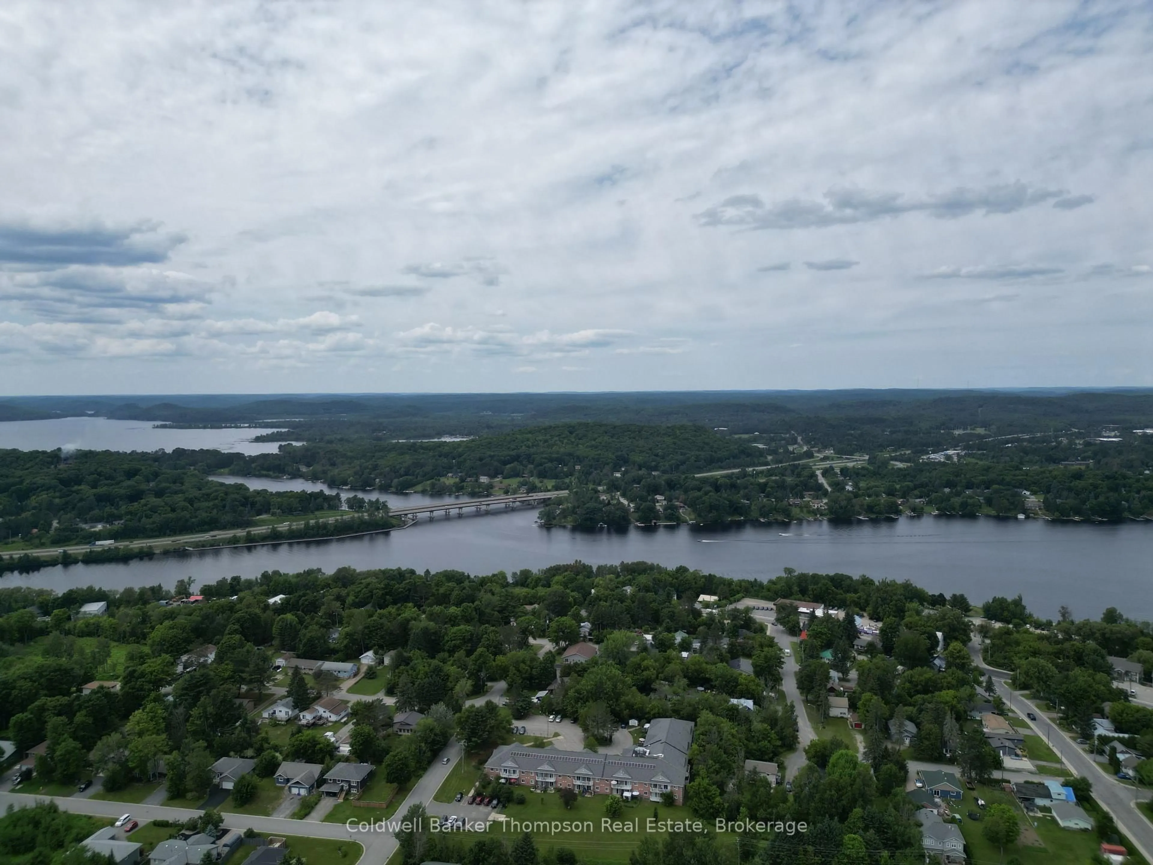 A pic from outside/outdoor area/front of a property/back of a property/a pic from drone, water/lake/river/ocean view for 8 Yonge St, Huntsville Ontario P1H 1W7