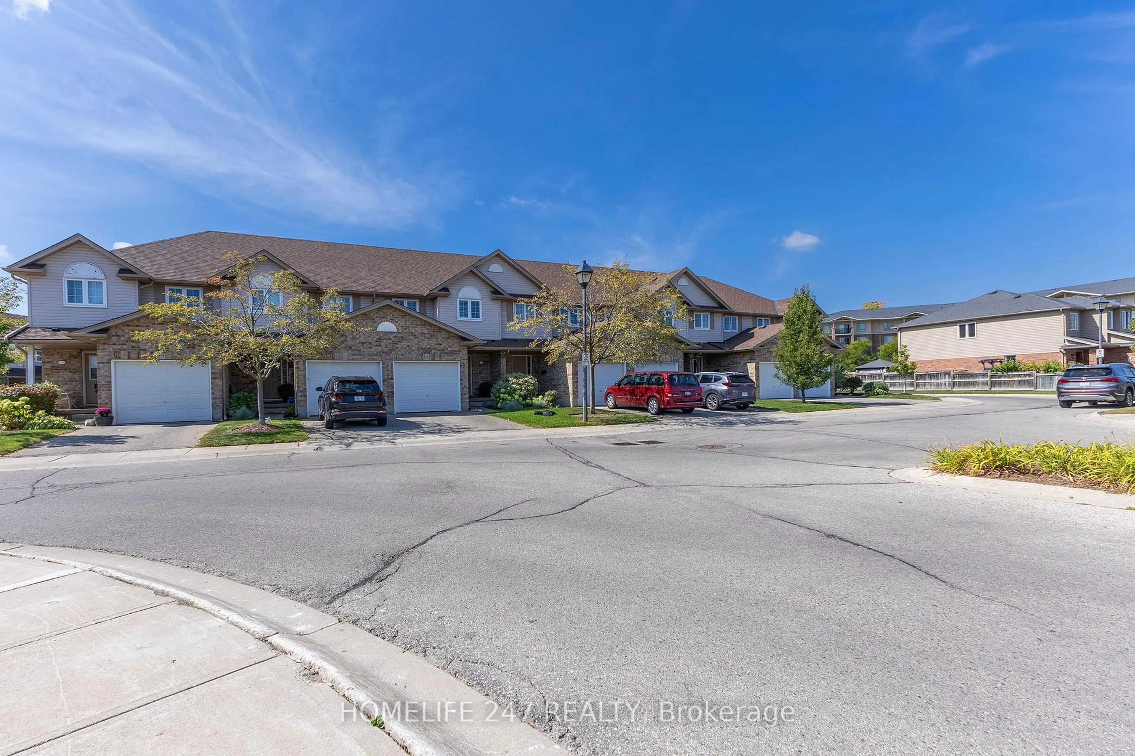 A pic from outside/outdoor area/front of a property/back of a property/a pic from drone, street for 31 Schroder Cres #5, Guelph Ontario N1E 7M6