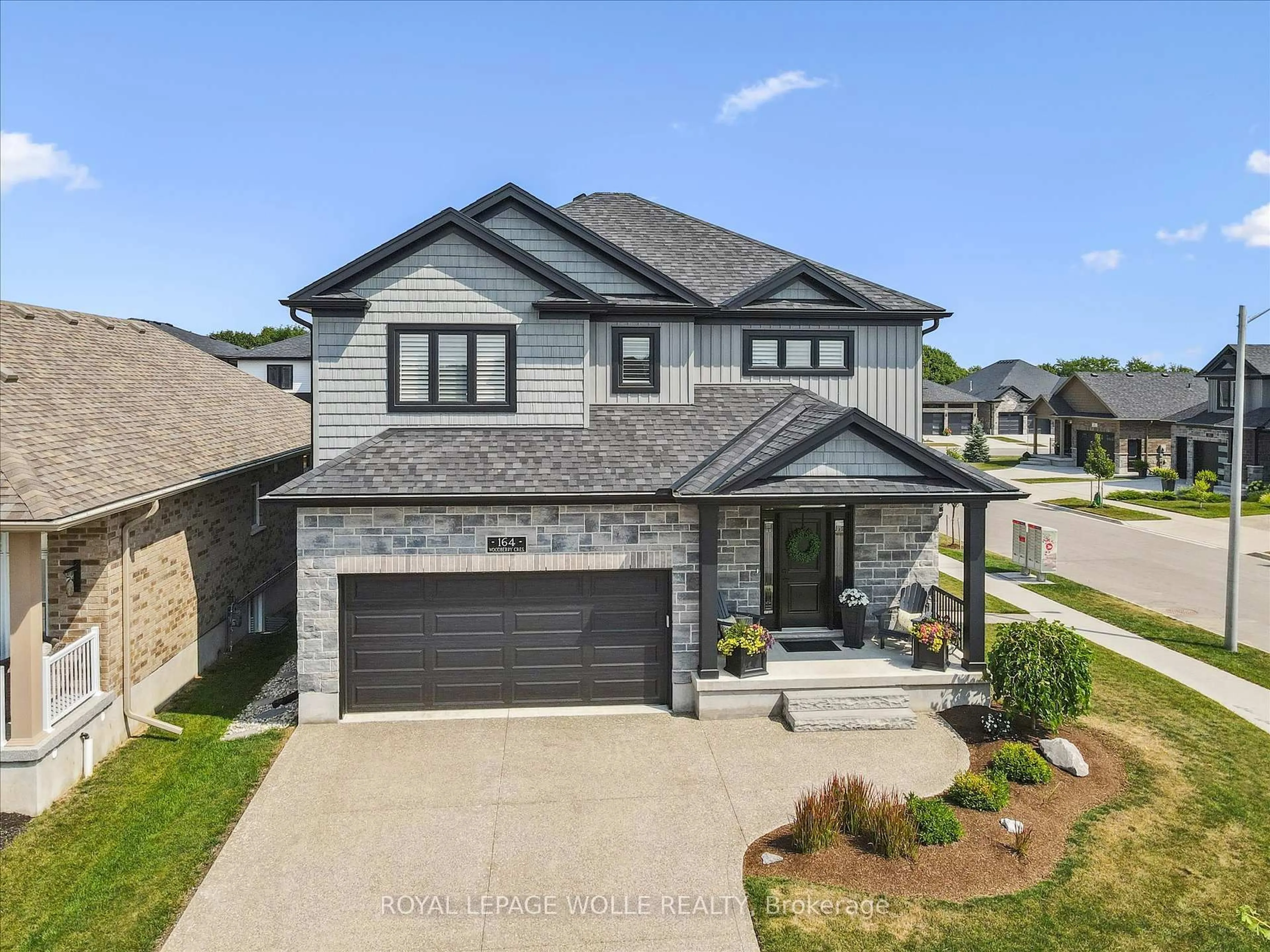 Home with brick exterior material, street for 164 WOODBERRY Cres, Woolwich Ontario N3B 0E4