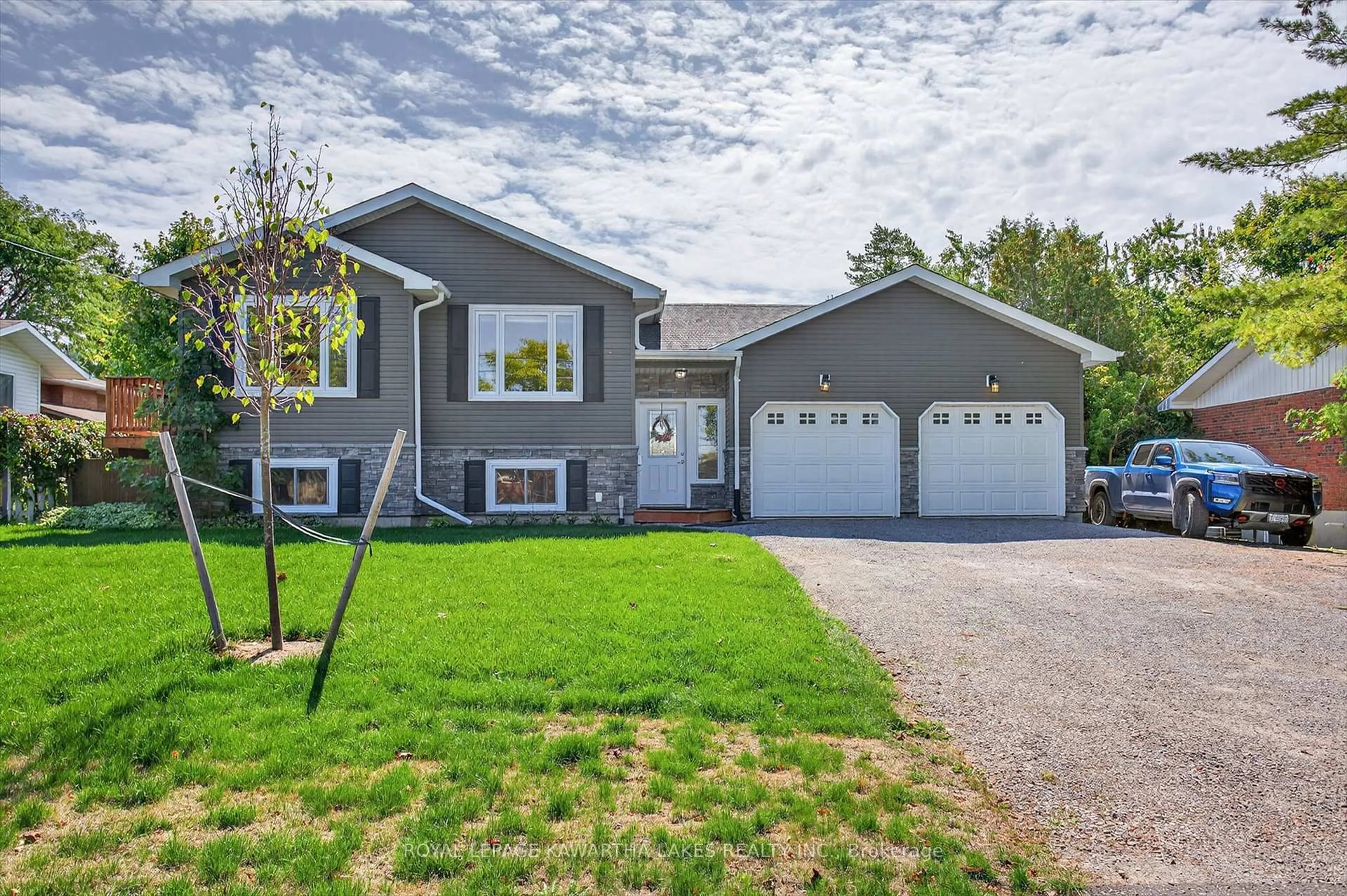 Home with vinyl exterior material, street for 21 Hillside Dr, Kawartha Lakes Ontario K9V 1A3