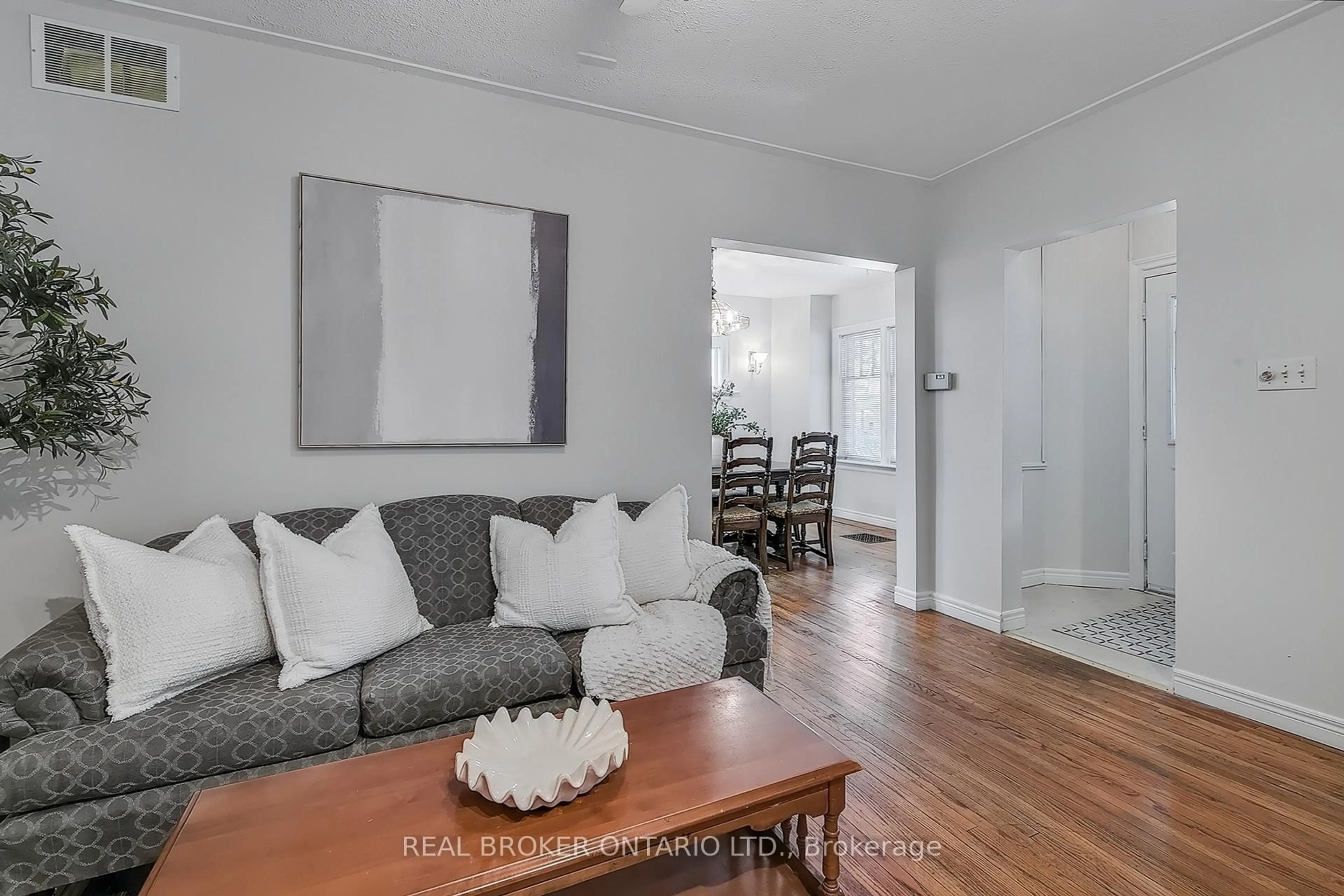 Living room with furniture, wood/laminate floor for 30 Troy St, Kitchener Ontario N2H 1L8