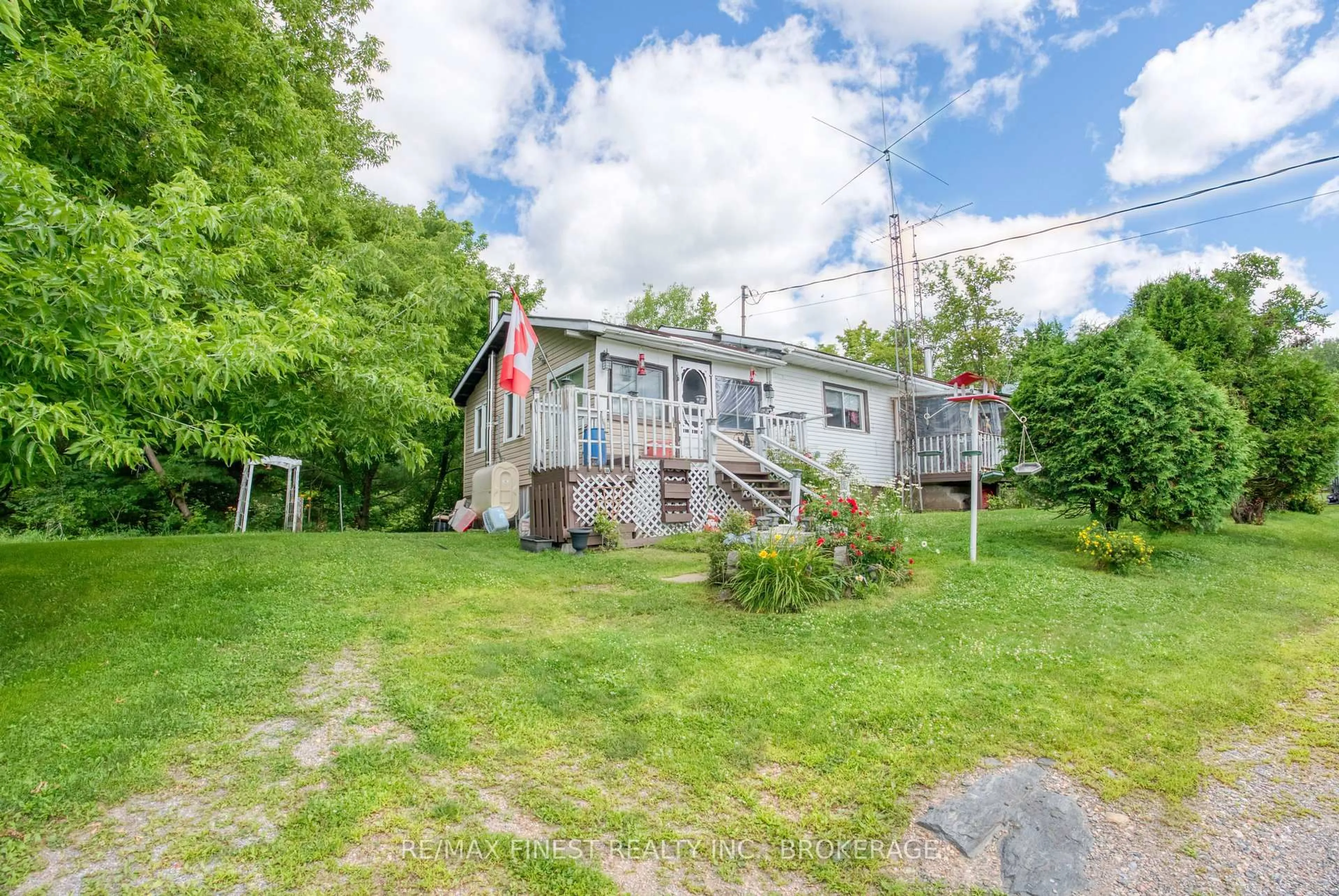 A pic from outside/outdoor area/front of a property/back of a property/a pic from drone, water/lake/river/ocean view for 30530 Highway 7, Arden Ontario K0H 1B0
