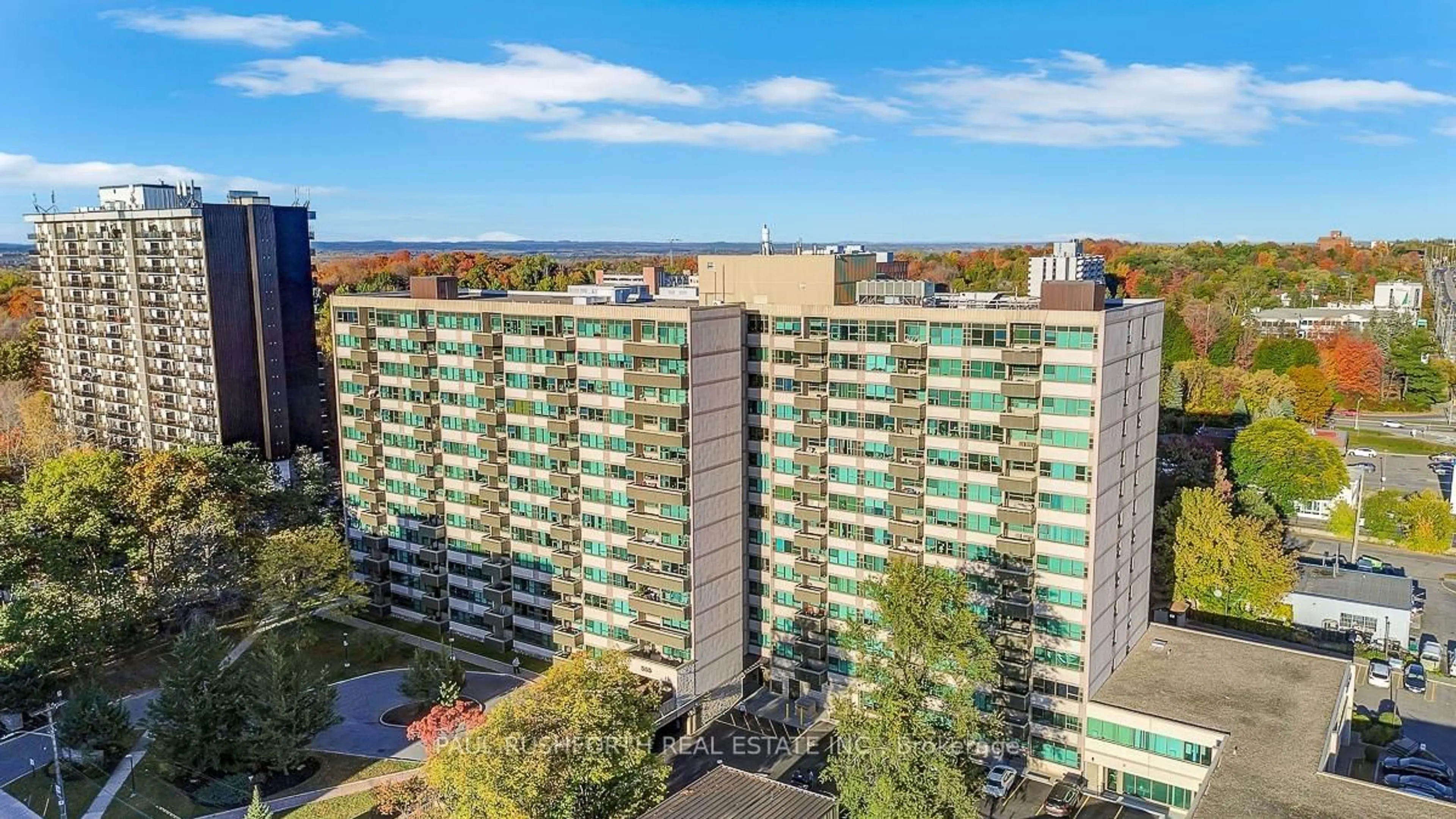 A pic from outside/outdoor area/front of a property/back of a property/a pic from drone, city buildings view from balcony for 555 Brittany Dr #707, Ottawa Ontario K1K 4C5