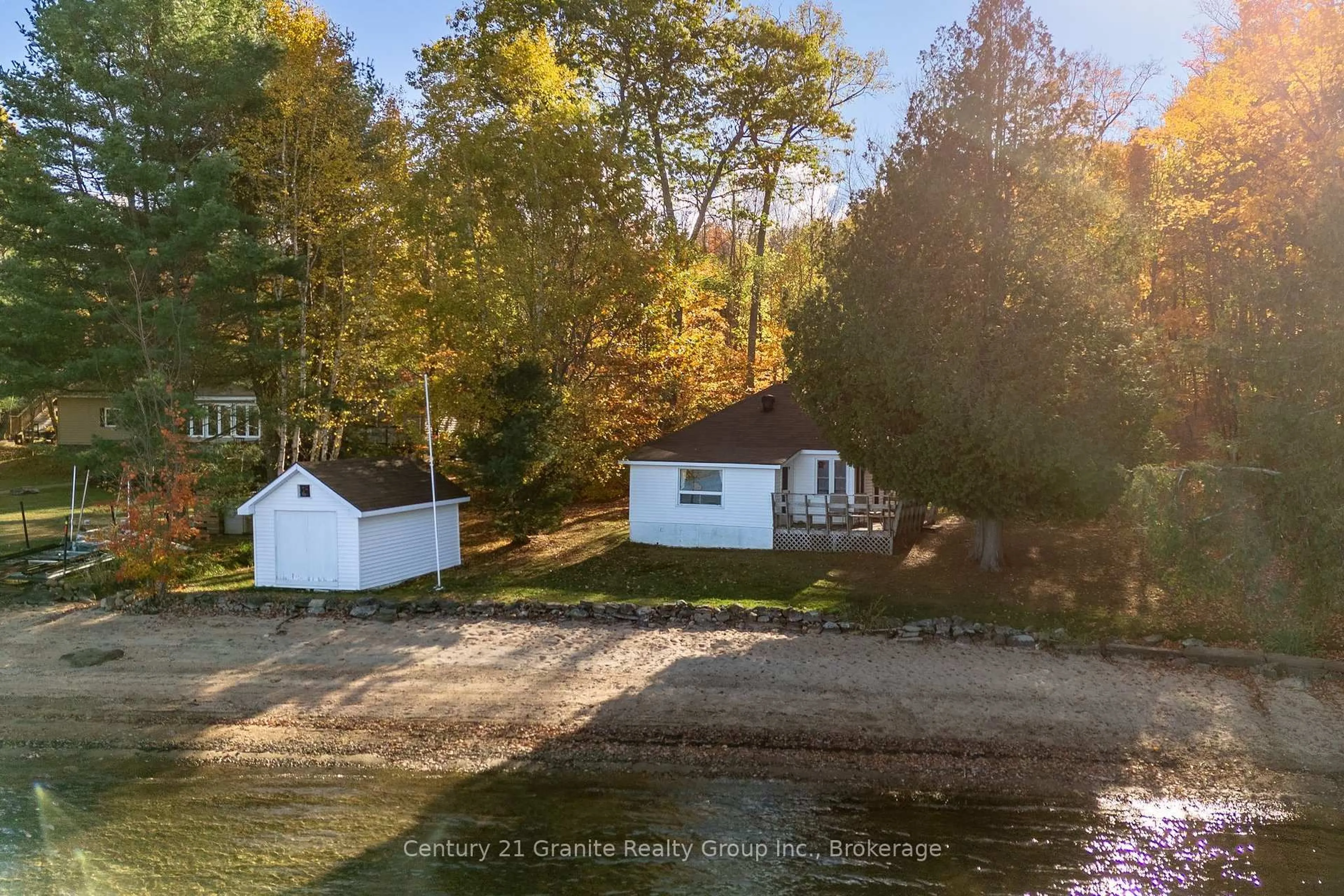 A pic from outside/outdoor area/front of a property/back of a property/a pic from drone, water/lake/river/ocean view for 17058 Highway 35, Algonquin Highlands Ontario K0M 1S0