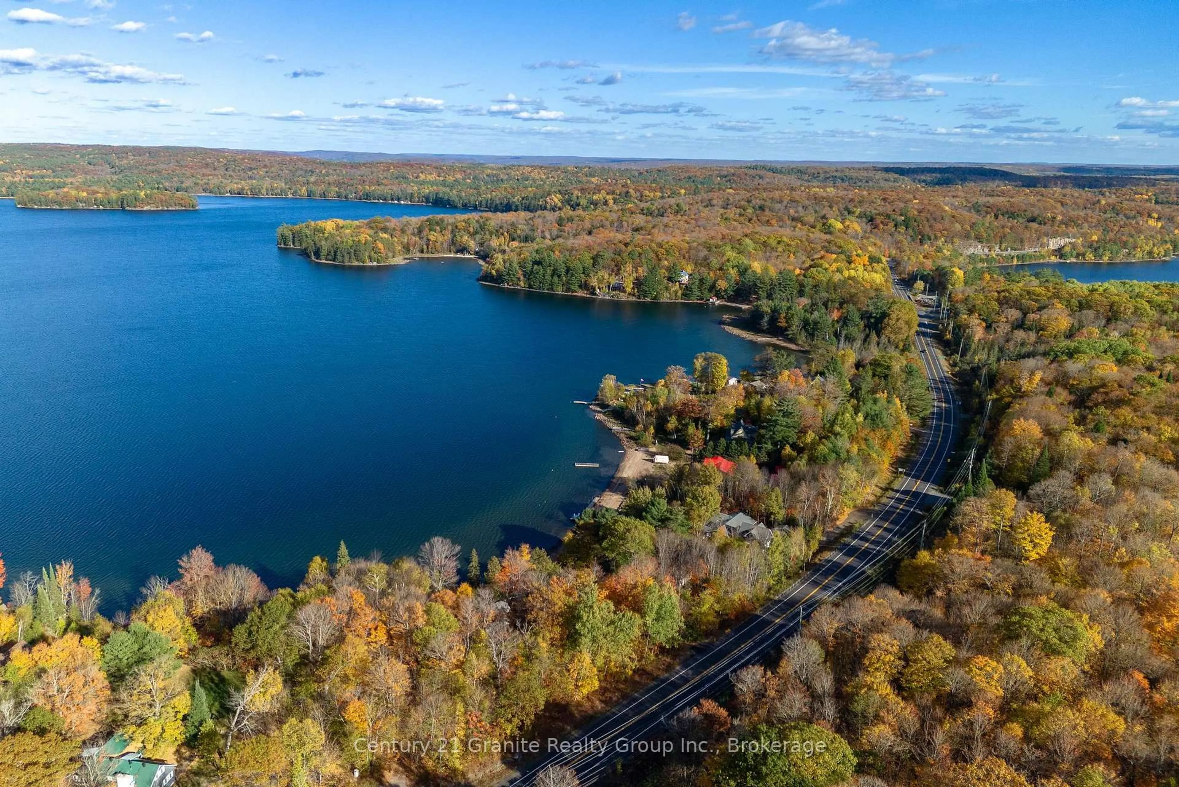 A pic from outside/outdoor area/front of a property/back of a property/a pic from drone, water/lake/river/ocean view for 17058 Highway 35, Algonquin Highlands Ontario K0M 1S0