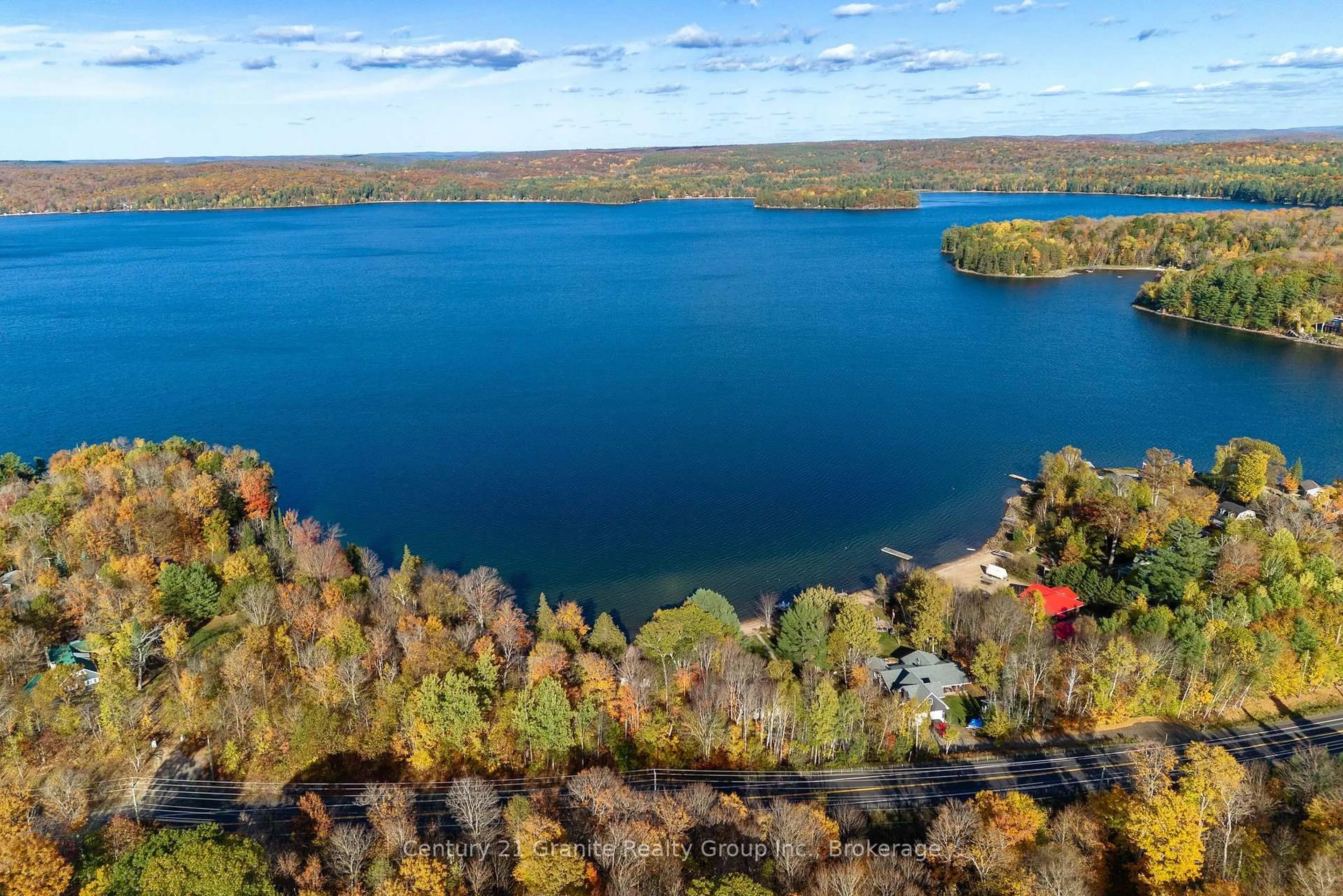 A pic from outside/outdoor area/front of a property/back of a property/a pic from drone, water/lake/river/ocean view for 17058 Highway 35, Algonquin Highlands Ontario K0M 1S0