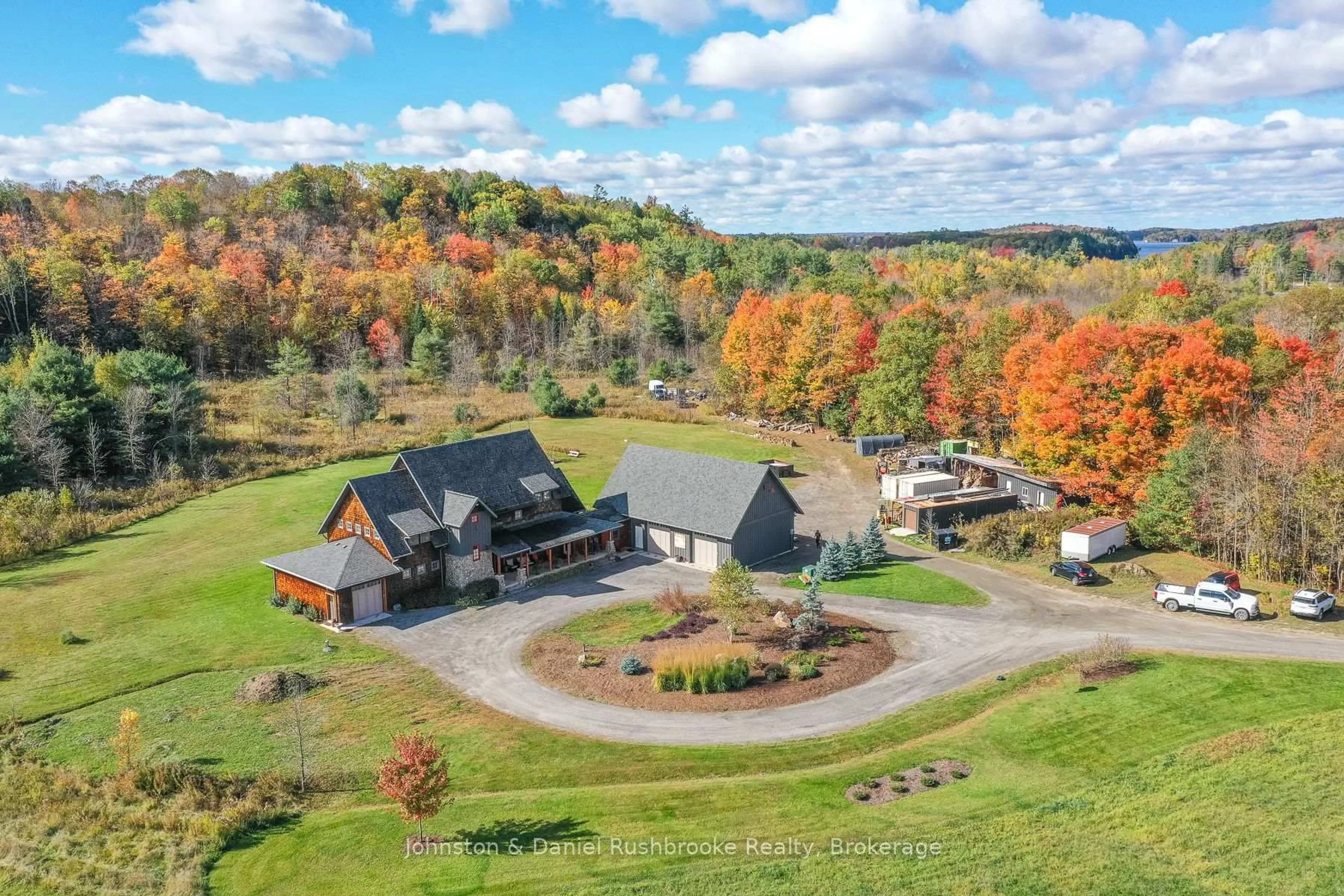 A pic from outside/outdoor area/front of a property/back of a property/a pic from drone, mountain view for 1422 Muskoka Rd 118 Rd, Bracebridge Ontario P1L 1W8