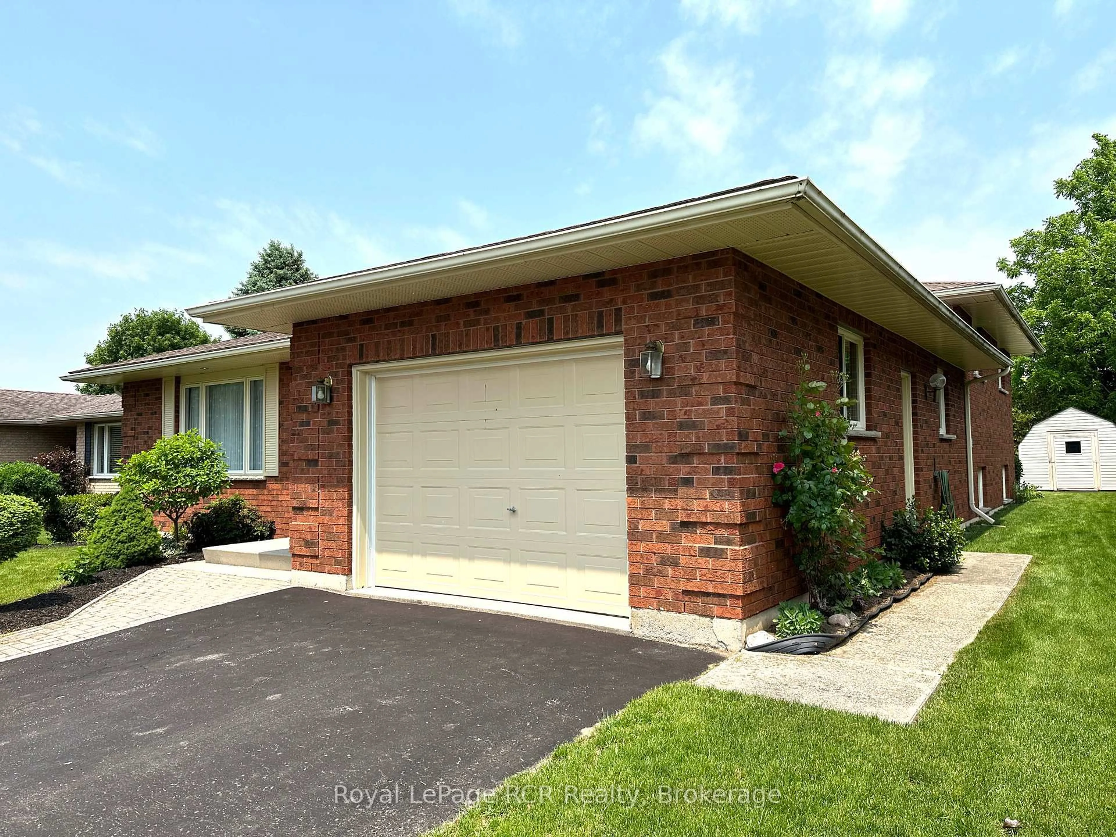 Home with brick exterior material, street for 218 4th Street Cres, Hanover Ontario N4N 3S2