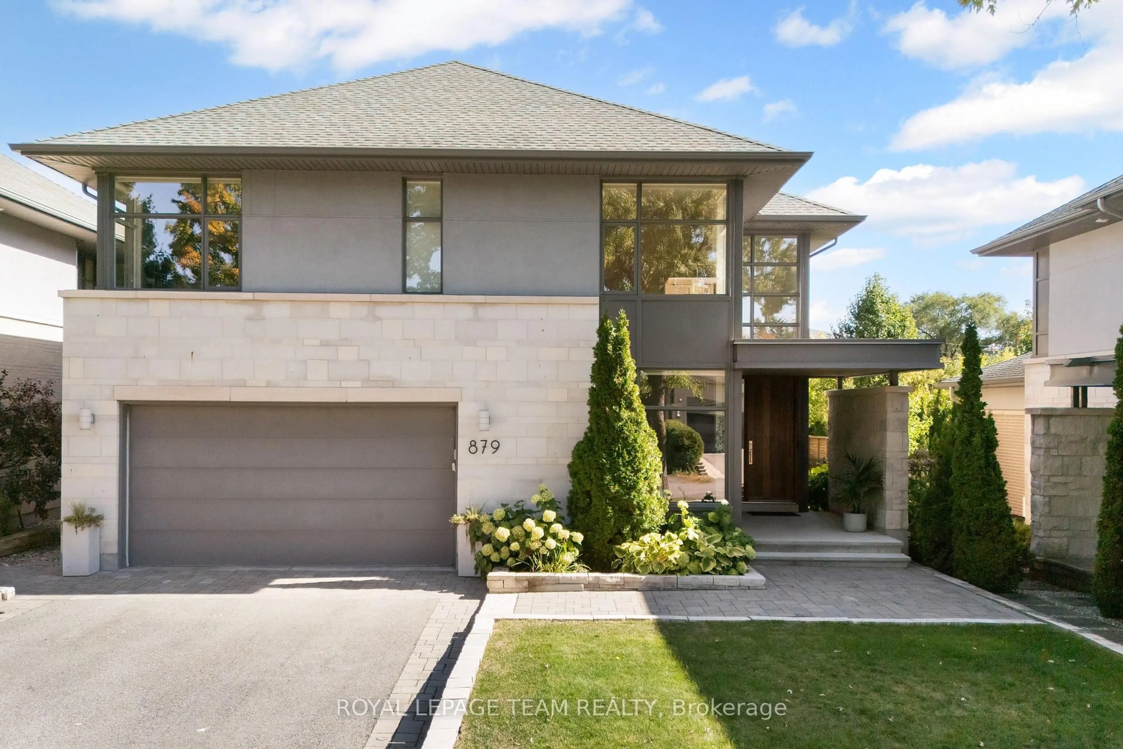Home with brick exterior material, street for 879 Winnington Ave, Ottawa Ontario K2B 5C4