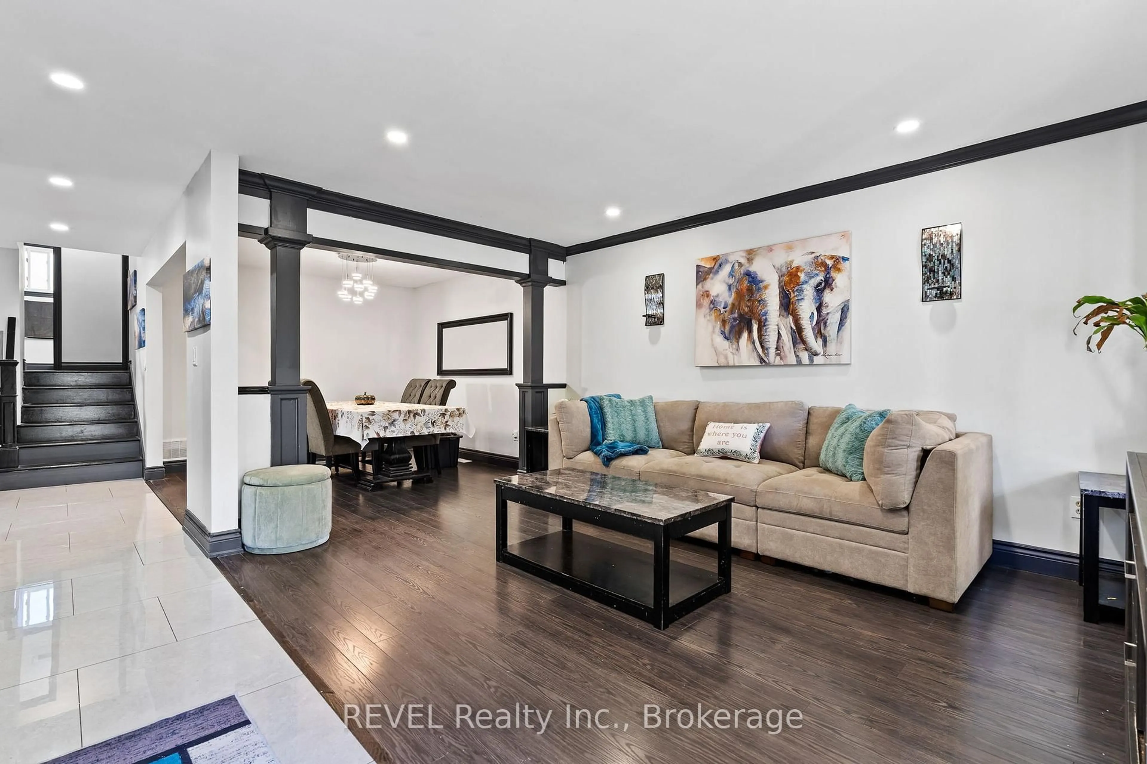 Living room with furniture, wood/laminate floor for 52 Sandra Cres, Grimsby Ontario L3M 4Y6