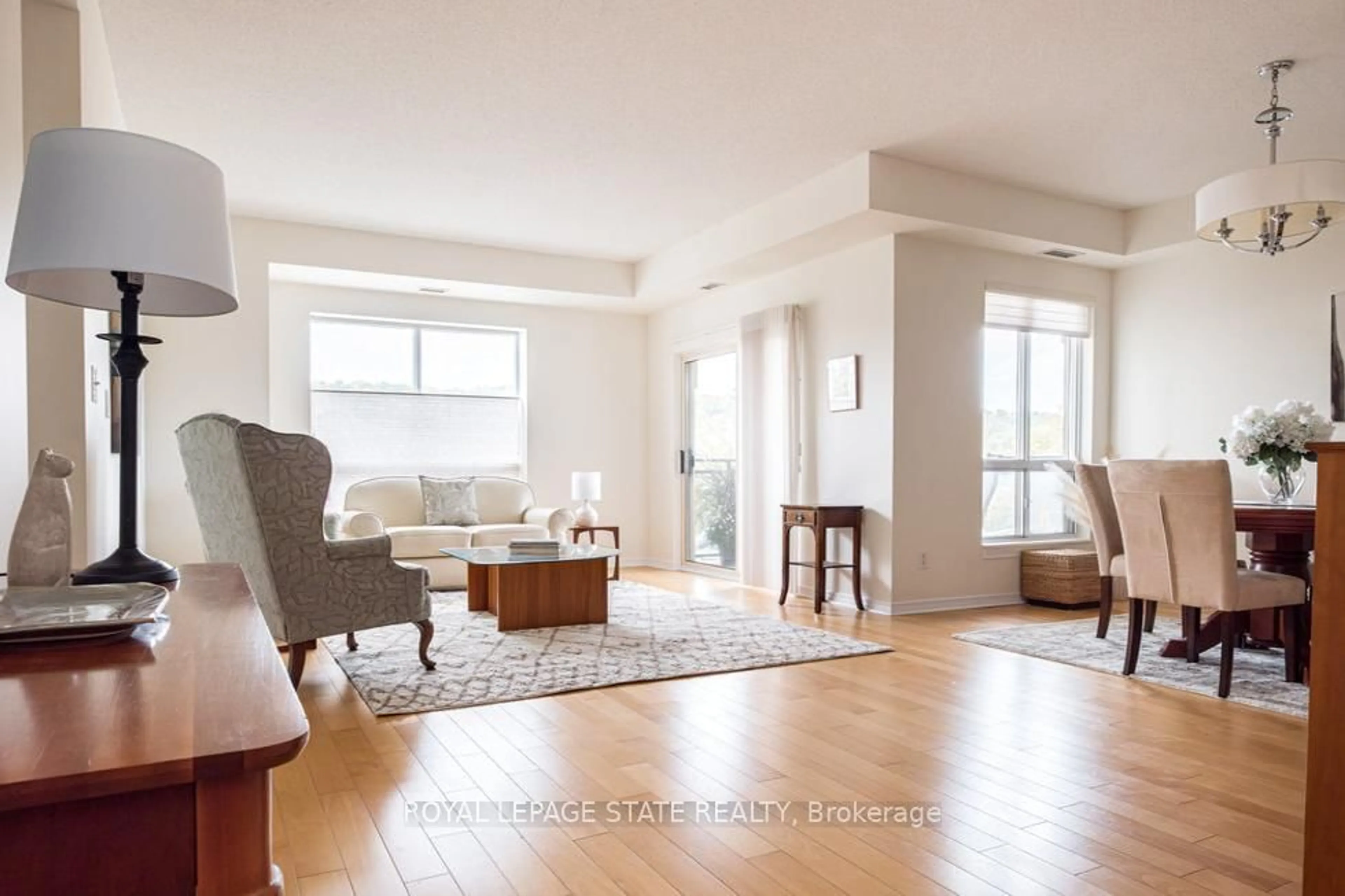 Living room with furniture, unknown for 4000 Creekside Dr #401, Hamilton Ontario L9H 7S9