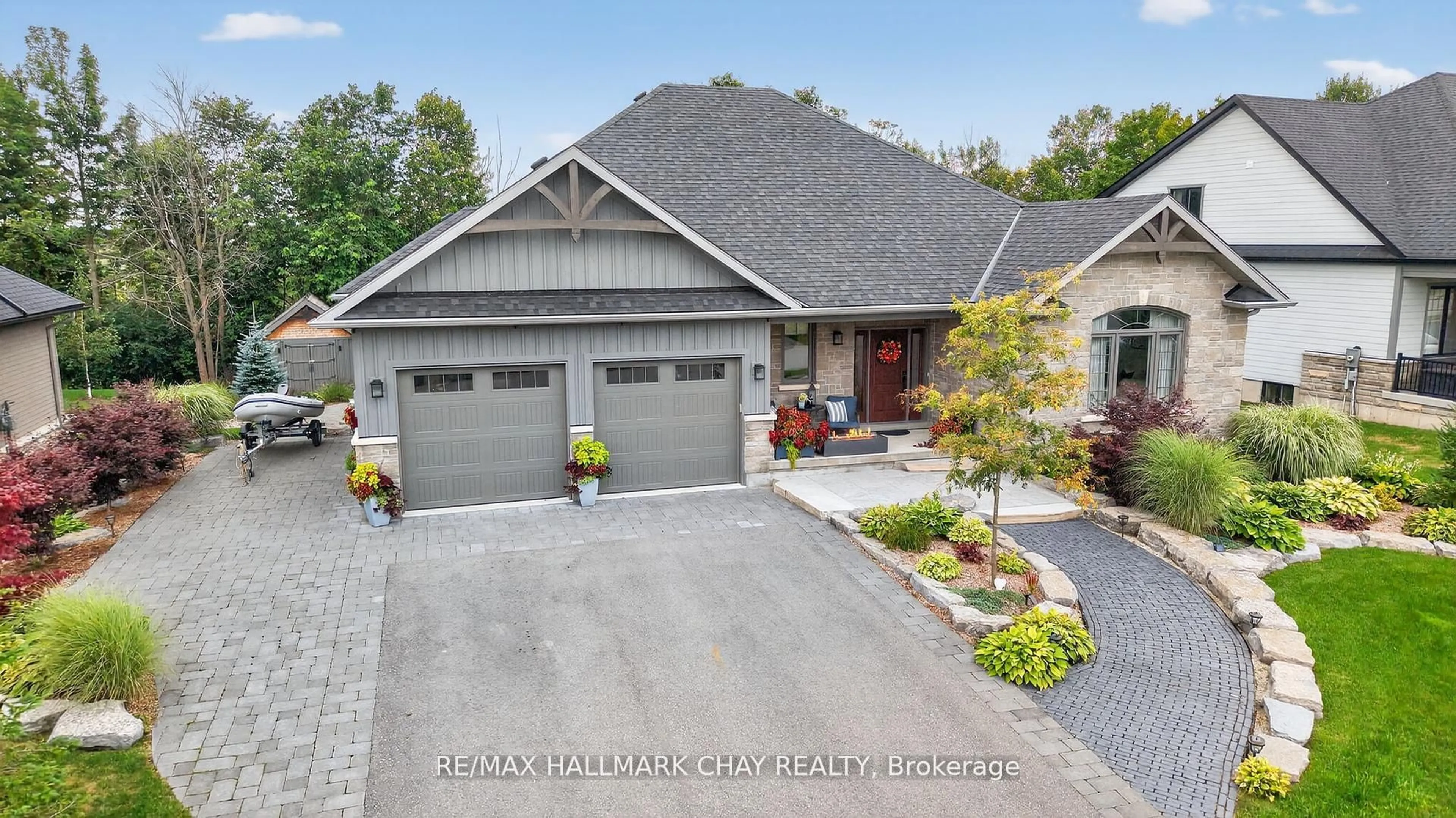 Home with brick exterior material, street for 127 High Bluff Lane, Blue Mountains Ontario N0H 2P0