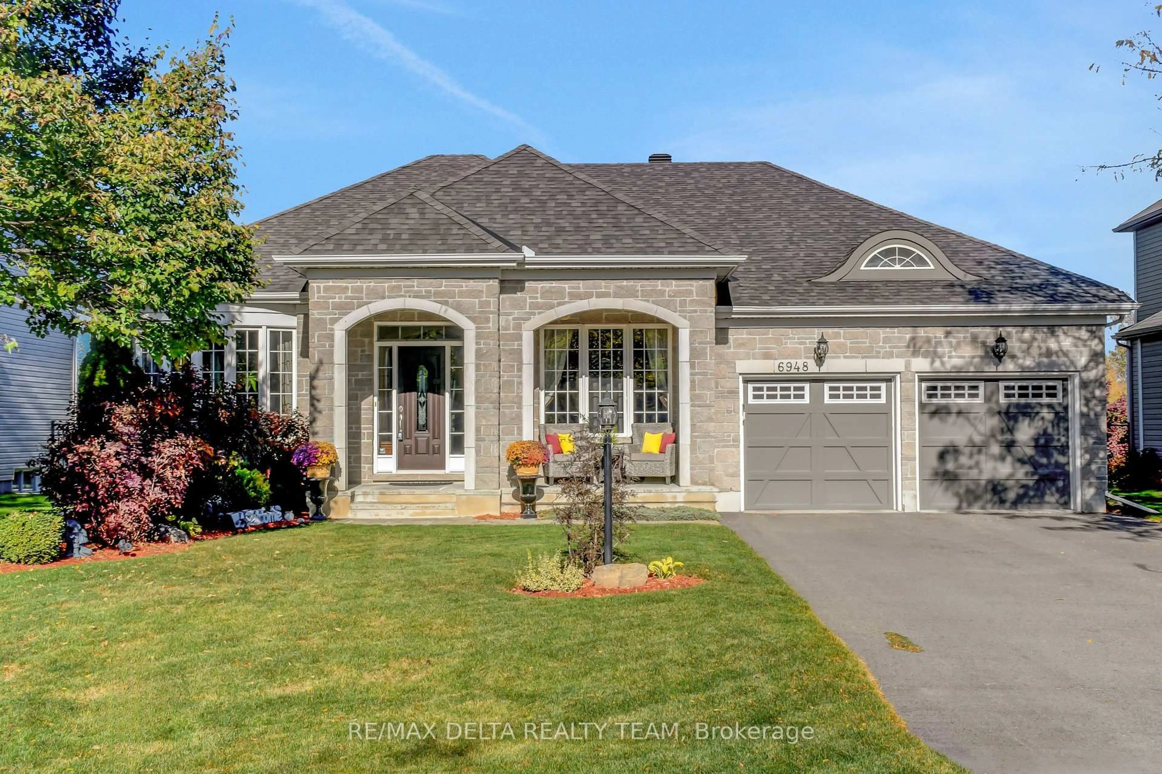 Home with brick exterior material, street for 6948 Mary Anne Dr, Ottawa Ontario K4P 0B9