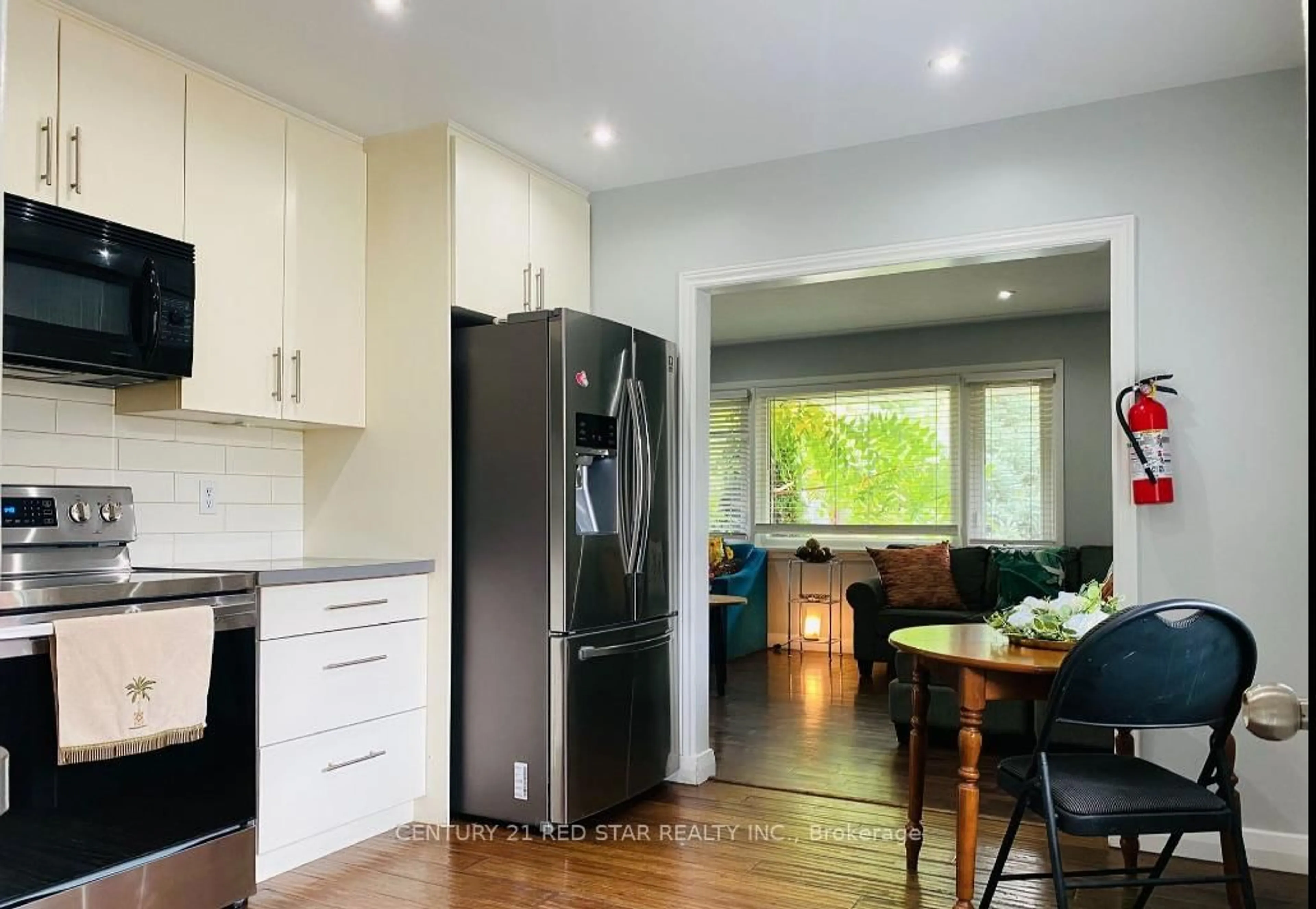 Open concept kitchen, wood/laminate floor for 107 Ellis Cres, Waterloo Ontario N2J 2C1