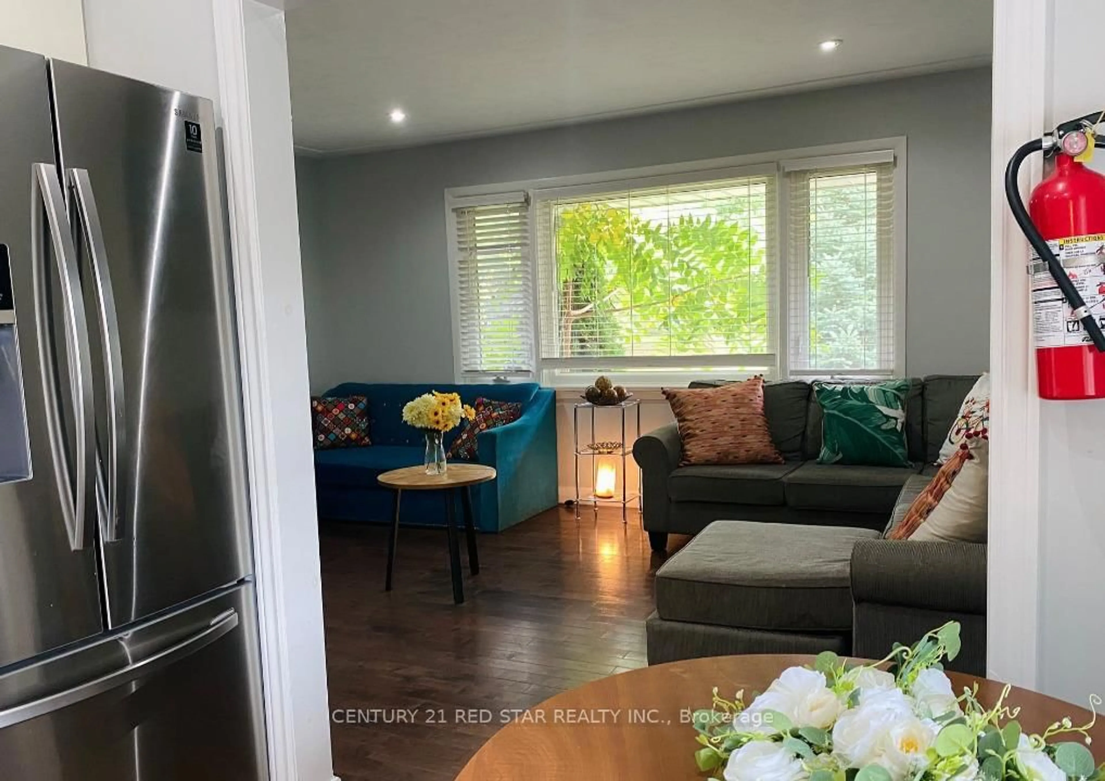 Living room with furniture, wood/laminate floor for 107 Ellis Cres, Waterloo Ontario N2J 2C1