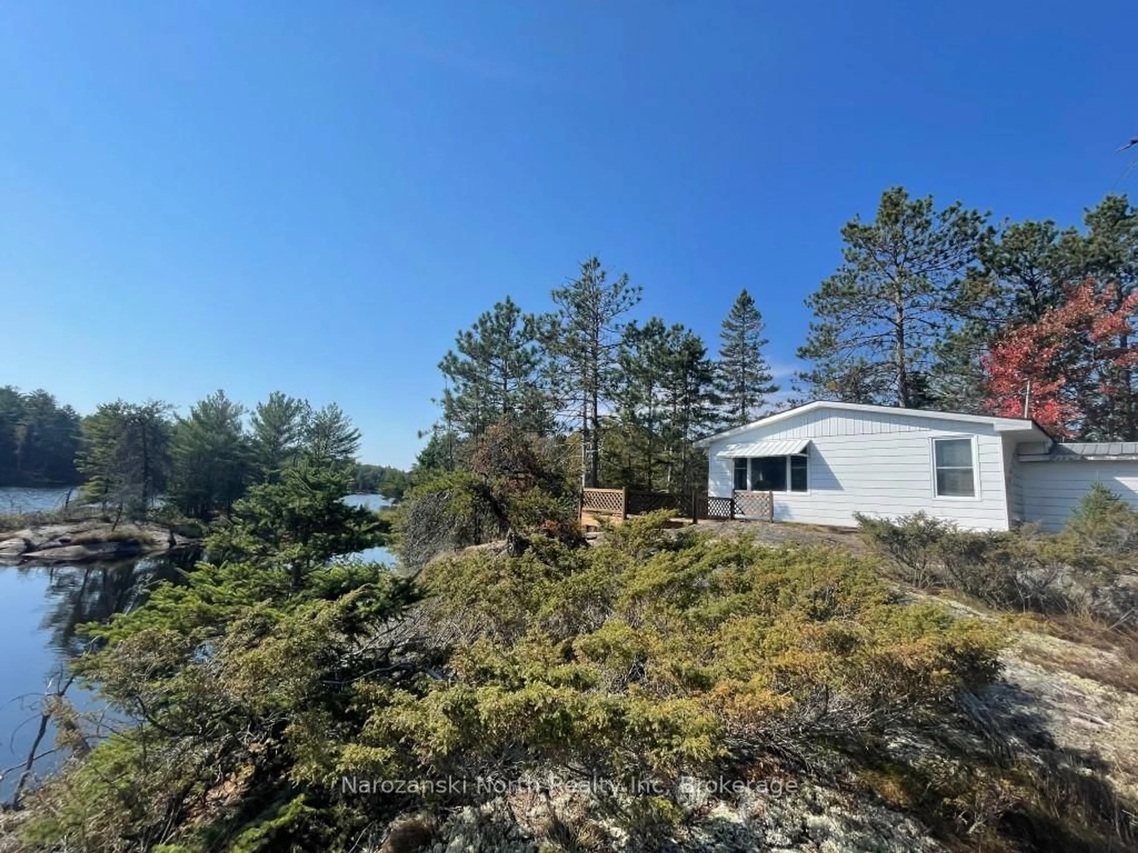 A pic from outside/outdoor area/front of a property/back of a property/a pic from drone, forest/trees view for 1096 East Rd, West Nipissing Ontario K6H 5R5